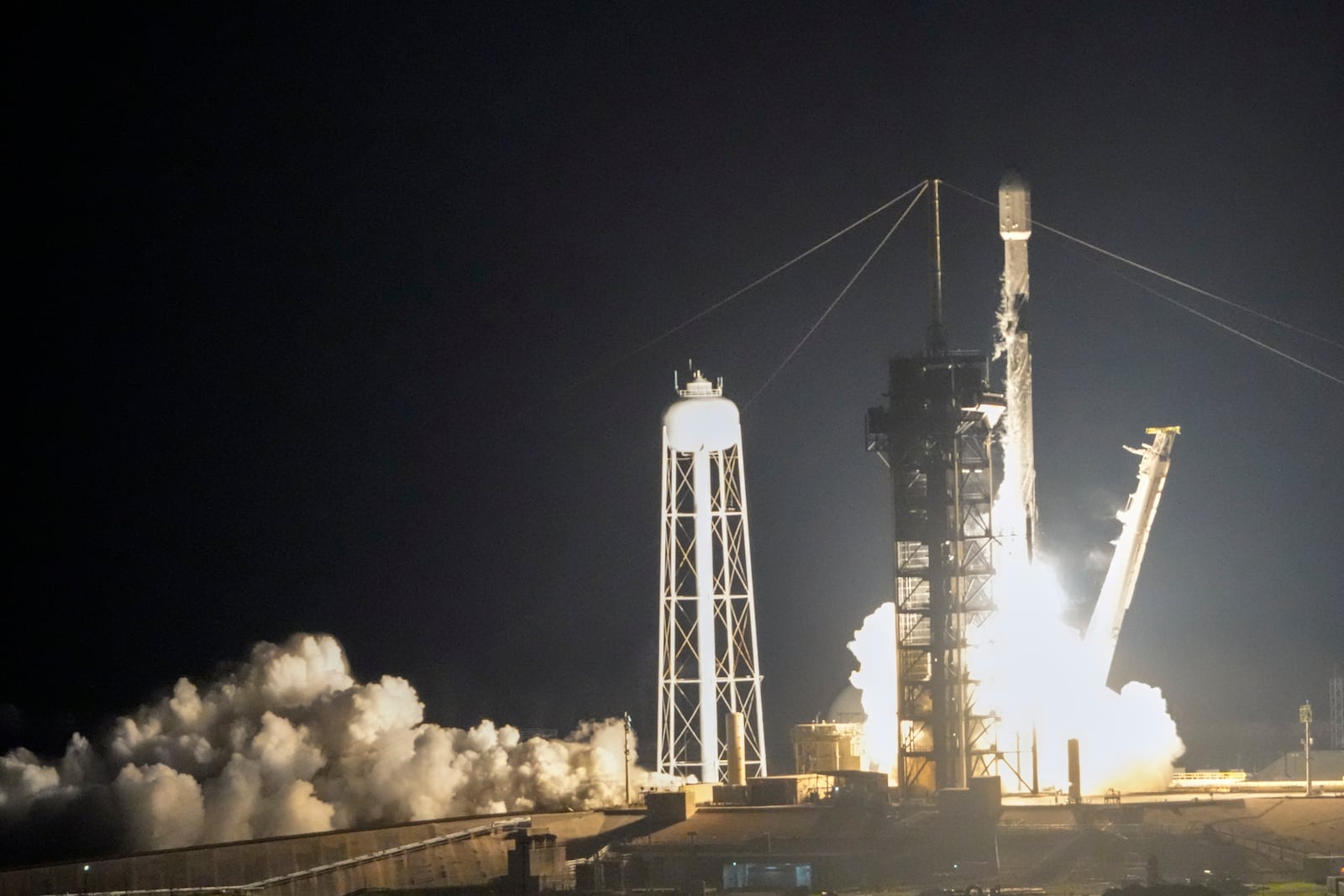 A SpaceX Falcon 9 rocket with Intuitive Machines' second lunar lander lifts off from pad 39A at the Kennedy Space Center in Cape Canaveral, Fla., Wednesday, Feb. 26, 2025. (AP Photo/John Raoux)