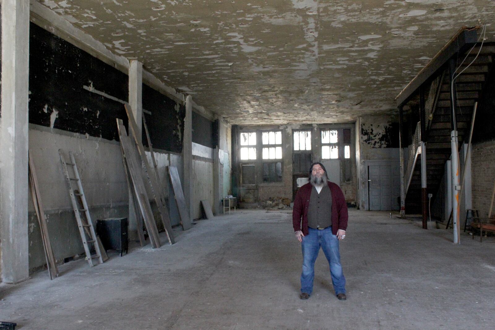 The Century Bar is moving from 10 Jefferson Street, next door to 18 to 20 S. Jefferson St, the former Dayton Power and Light Building.  Co-owner Joe Head is pictured on the building's first floor of the old DP&L building.