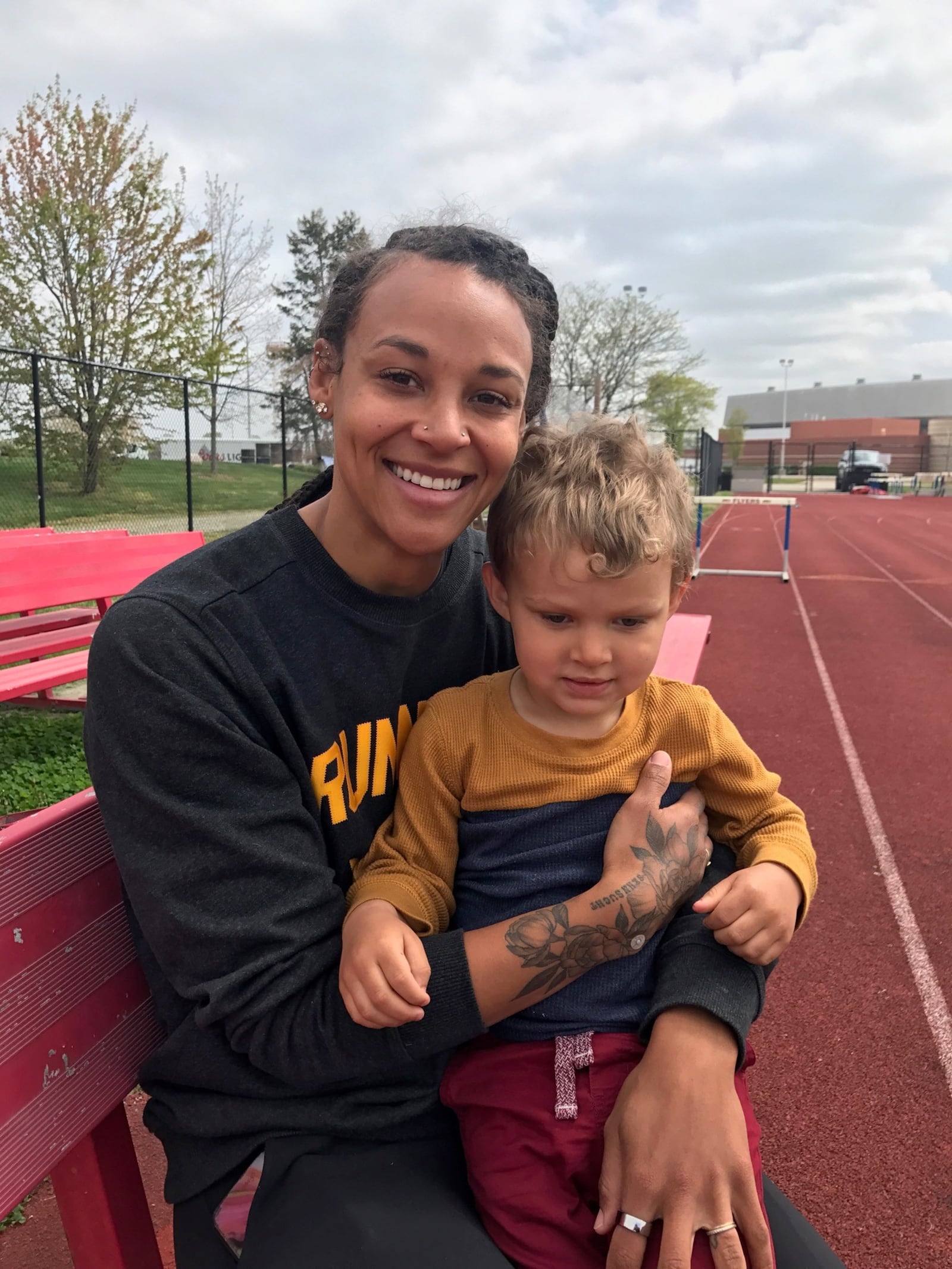 Former Olympian Chantae McMillan and her 2 ½ year old son Otto before her training session at the University of Dayton track a few days ago. (Photo by Tom Archdeacon)