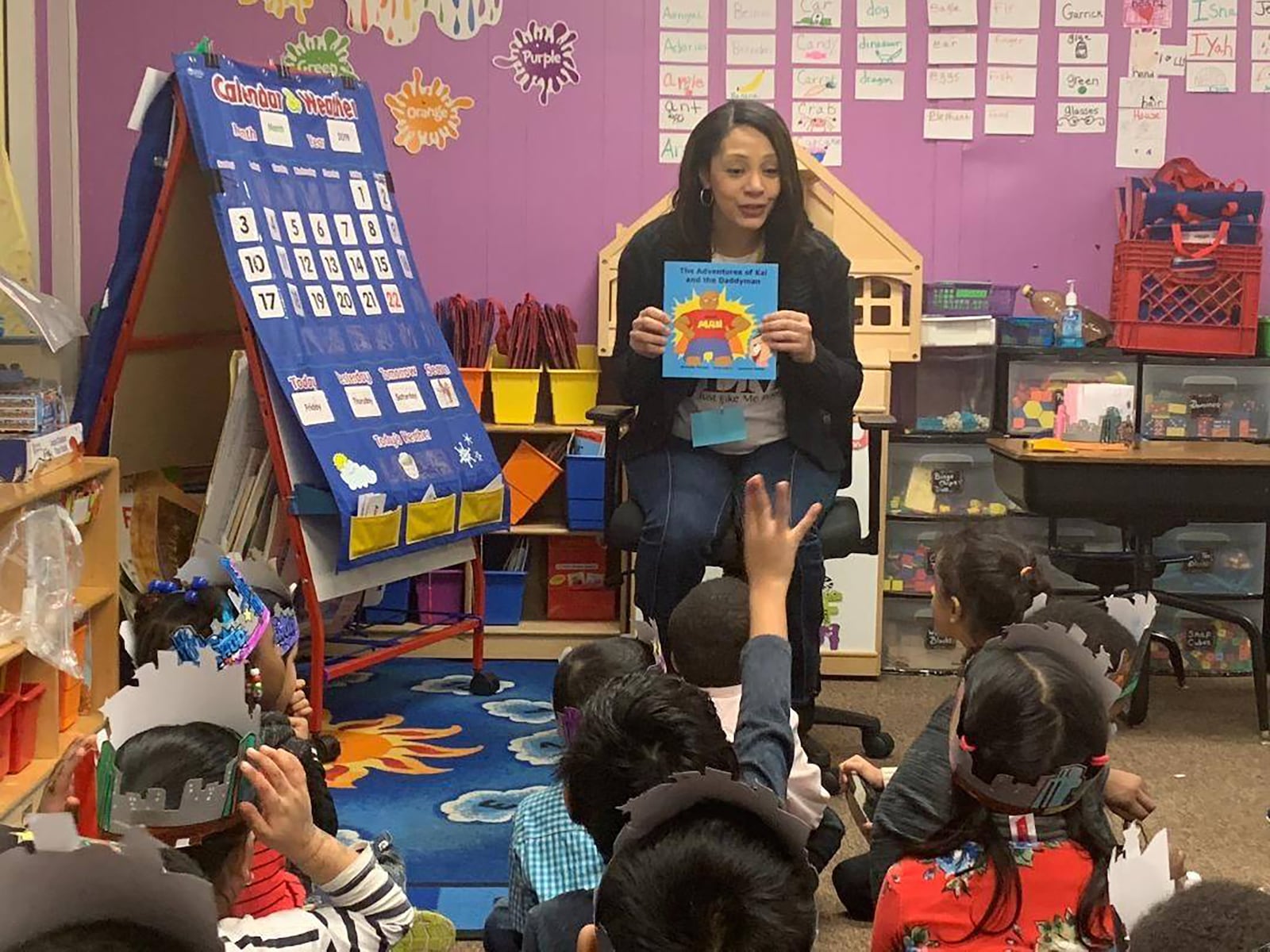 Michelle Person of Beavercreek has started a business, Just Like Me Presents, and is working to develop culturally diverse educational materials. She is shown reading one of her books to a class of school children at Dickinson West Elementary School in Hamtramck, Michigan. CONTRIBUTED