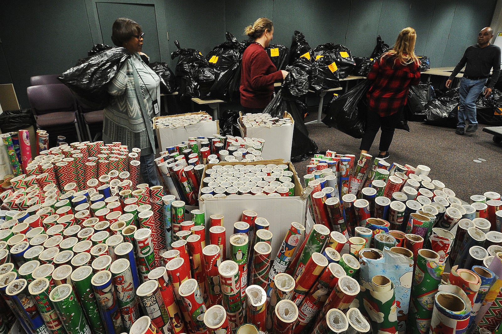 For the Love of Children (FLOC) delivered Christmas wrapping paper and gifts to the Haines Children’s Center Wednesday, Dec. 14, 2022 for nearly 2,000 kids working with Montgomery County Children Services. MARSHALL GORBY\STAFF