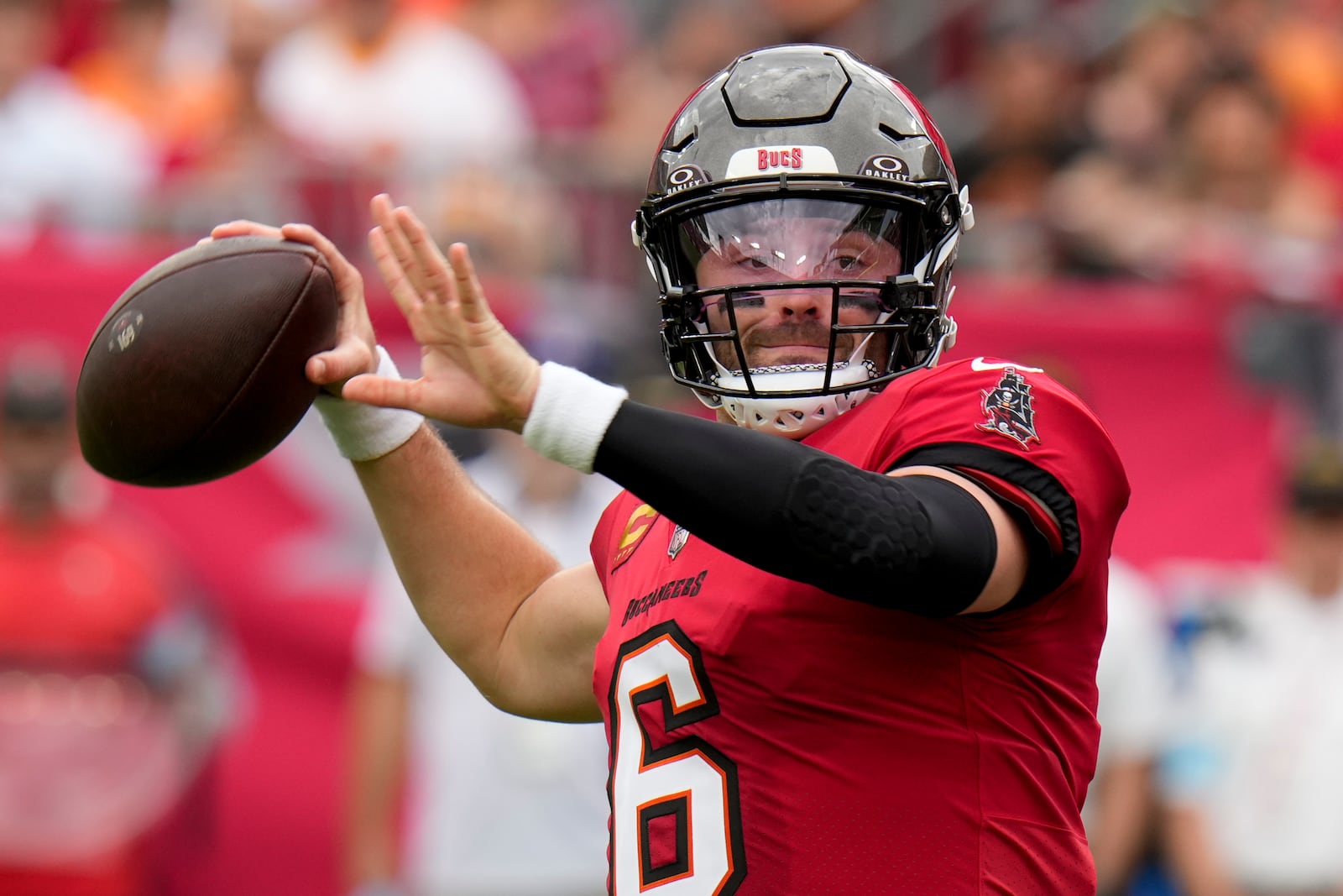 Tampa Bay Buccaneers quarterback Baker Mayfield passes for a touchdown against the Carolina Panthers during the first half of an NFL football game Sunday, Dec. 29, 2024, in Tampa, Fla. (AP Photo/Chris O'Meara)