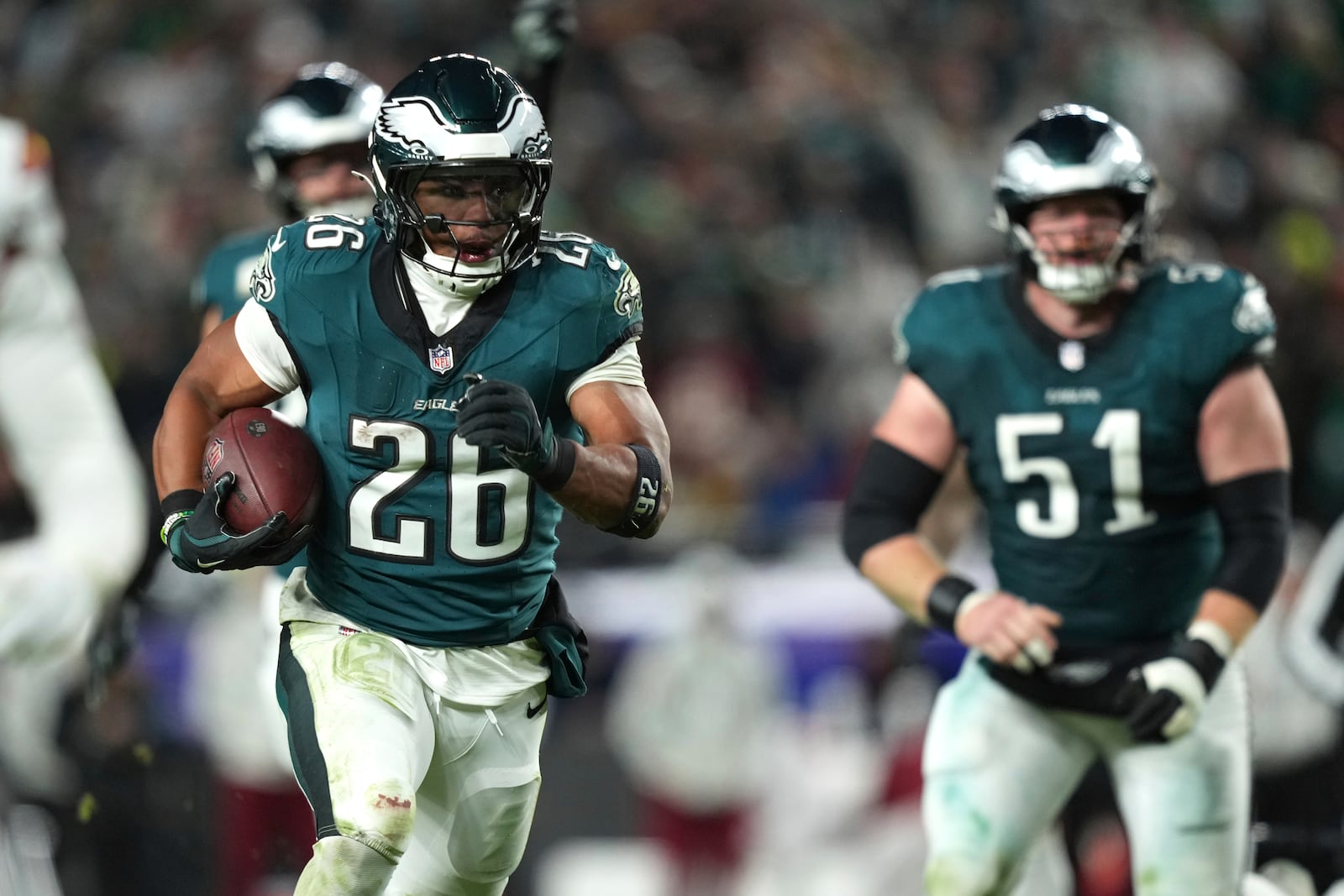 Philadelphia Eagles running back Saquon Barkley (26) runs for a touchdown during the second half of an NFL football game against the Washington Commanders Thursday, Nov. 14, 2024, in Philadelphia. (AP Photo/Matt Slocum)