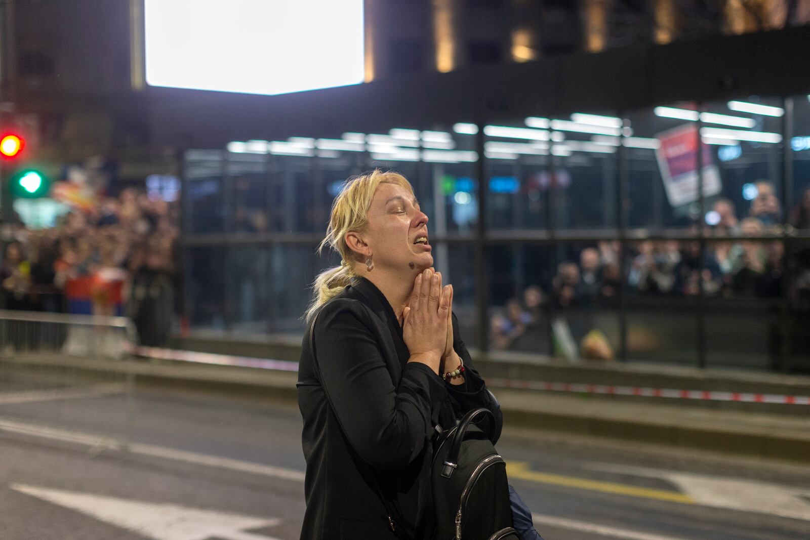 Dijana Hrka, mother of a young man killed in a train station canopy collapse, cries as she attends a protest ahead of a major anti-corruption rally this weekend, in Belgrade, Serbia, Friday, March 14, 2025. (AP Photo/Marko Drobnjakovic)