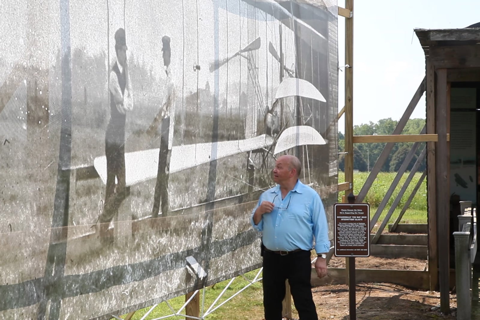 Dan Patterson, Artist in Residence with the Dayton Aviation Heritage National Historical Park in 2017 had a 1904 image of the Wright Brothers on Huffman Prairie printed on mesh for display on the site of the original photo.  The photo has since be removed after wind damaged the photo supporting structure twice.  TY GREENLEES / STAFF