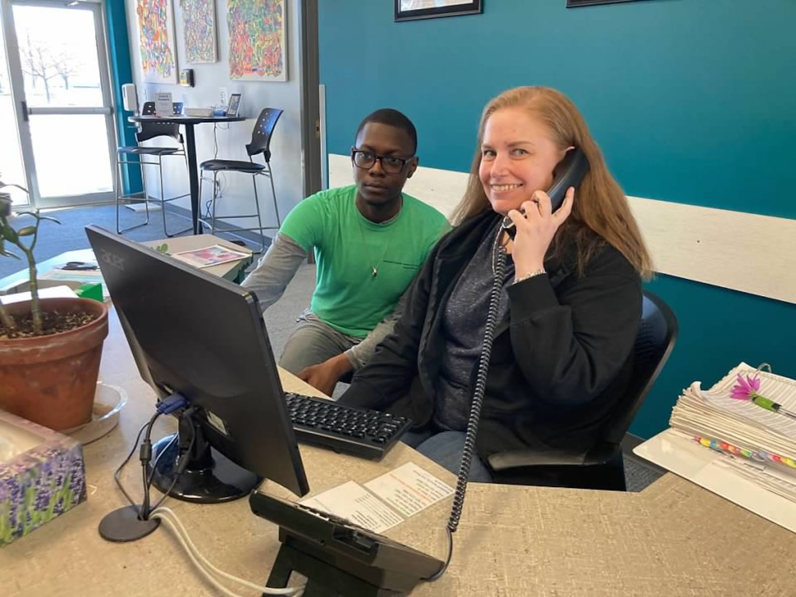 Intern Henry Grey & Clubhouse member Megan Lisboa  at the Clubhouse reception desk. CONTRIBUTED