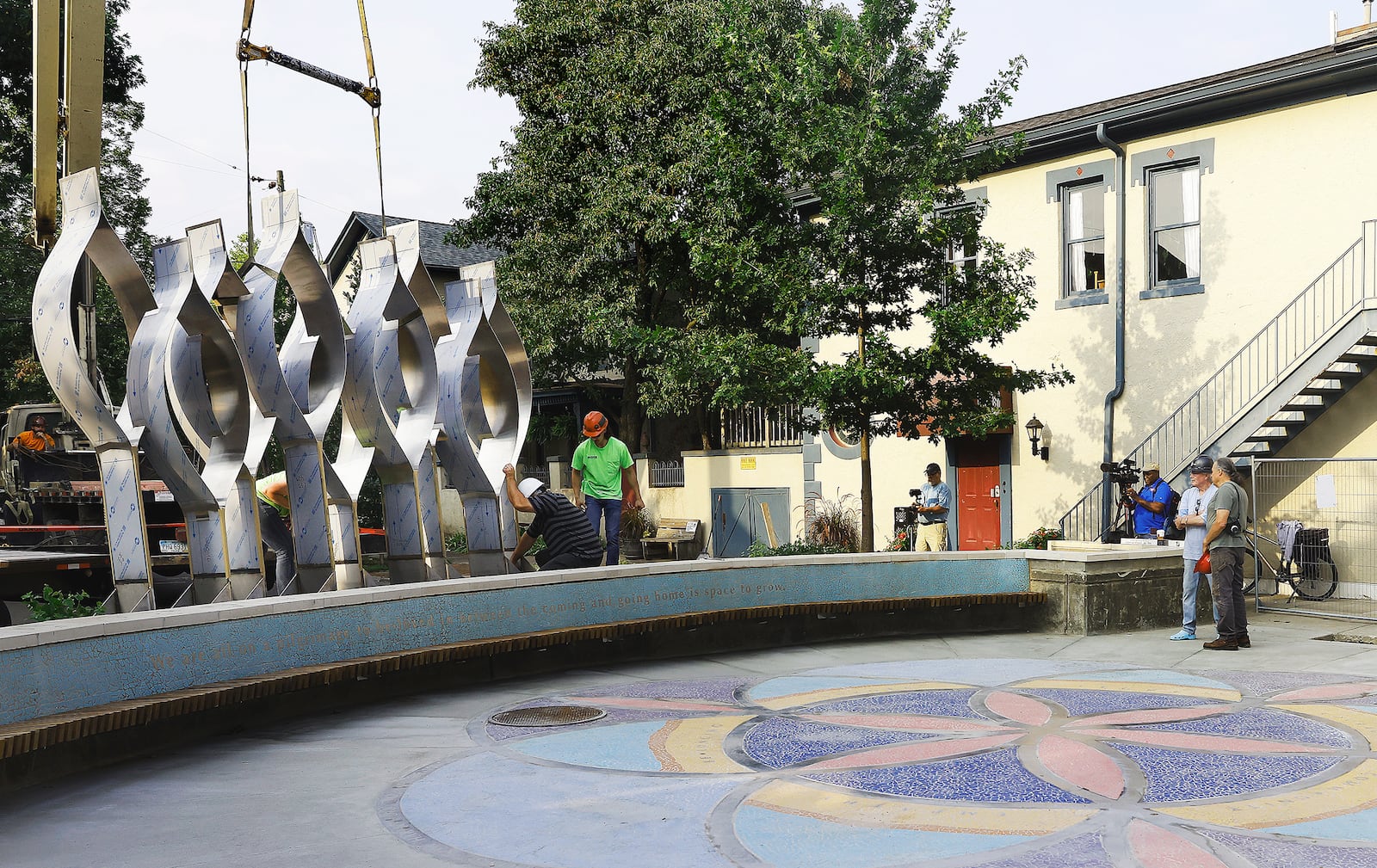 The Seed of Life sculpture for the Oregon District shooting memorial was craned in Thursday, July 25, 2024. MARSHALL GORBY\STAFF