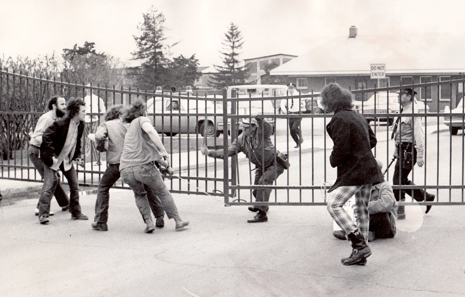 Protestors and security police scuffle April 16, 1972 at Wright-Patterson Air Force Base. The gate was later opened when two colonels agreed to discuss protestors grievances. DAYTON DAILY NEWS ARCHIVE