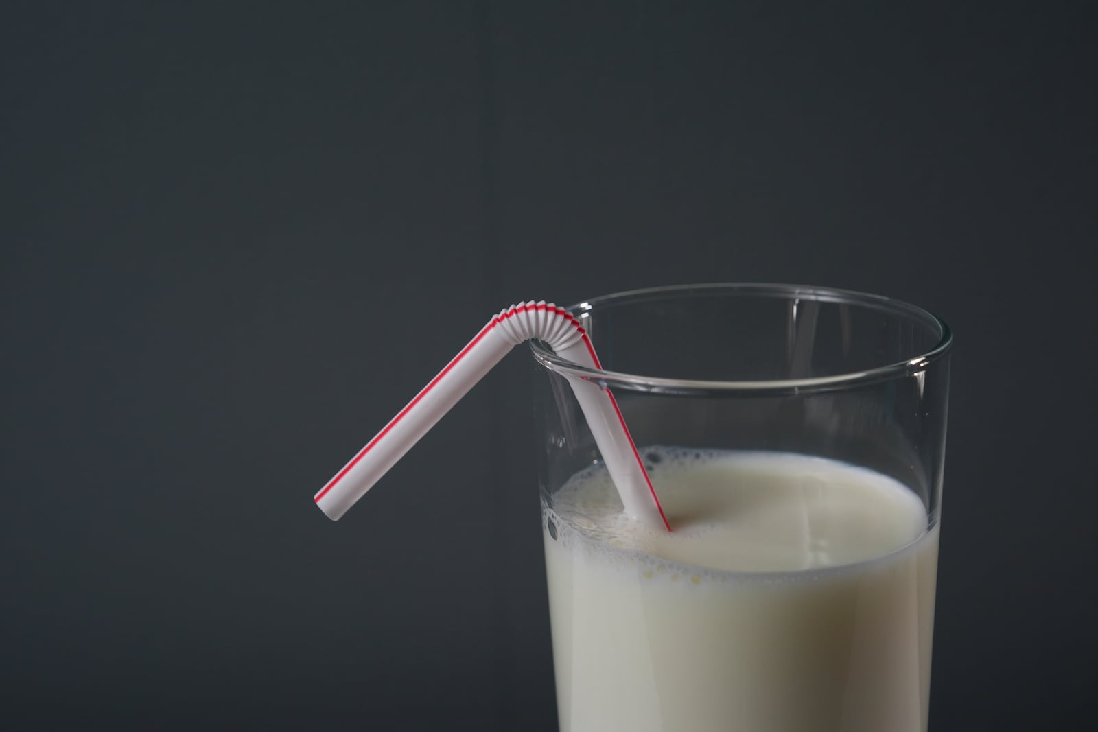 A plastic straw is displayed in a glass of milk, Tuesday, Feb. 11, 2025, in Cincinnati. (AP Photo/Joshua A. Bickel)