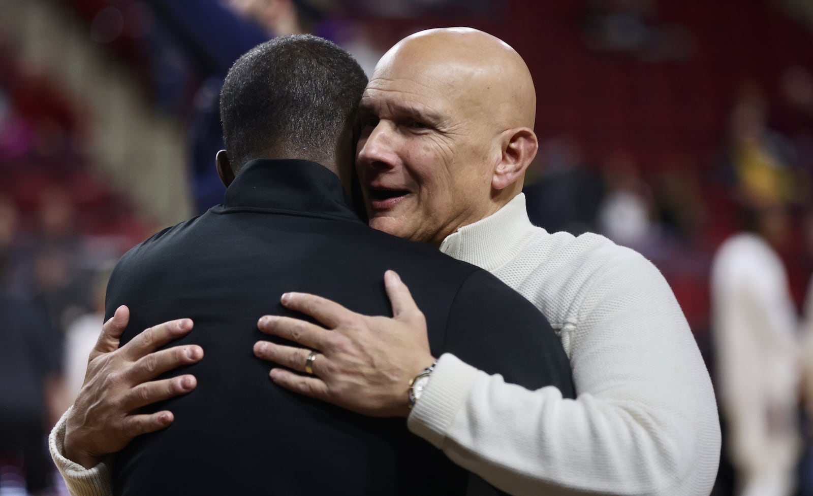 Massachusetts coach Frank Martin hugs Dayton's Anthony Grant before the game on Wednesday, Jan. 8, 2025, at the Mullins Center in Amherst, Mass. David Jablonski/Staff