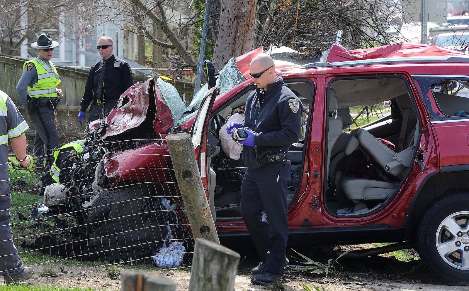 OSP and Troy police search a Jeep at U.S. 40 and state Route 202 after a Troy police chase ended in a double fatal crash on Tuesday, March 30, 2021. MARSHALL GORBY / STAFF