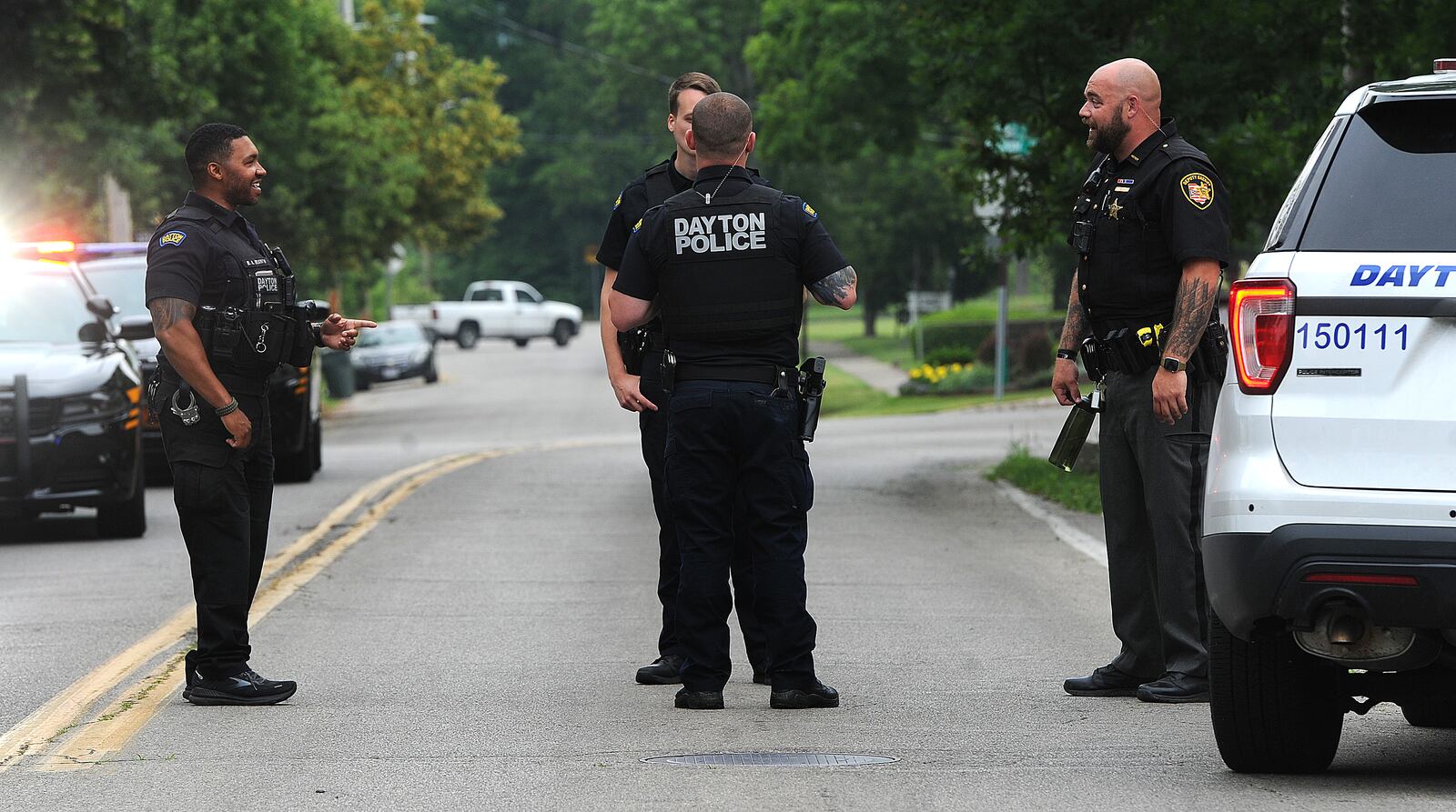 Montgomery County sheriff's deputies and Dayton police held a juvenile at gun point after he was seen running through a neighborhood near North Dixie Drive with a handgun Monday morning June 19, 2023. The juvenile was apprehended hiding in a garden behind a house on Ridge Road. MARSHALL GORBY\STAFF