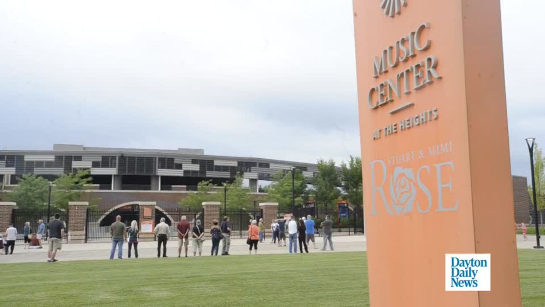 People lined up outside the Rose Music Center at the Heights free coronavirus testing.