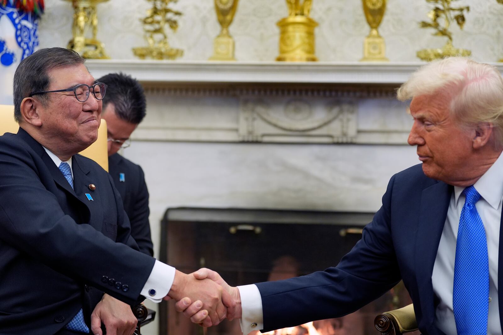 President Donald Trump greets Japanese Prime Minister Shigeru Ishiba in the Oval Office of the White House, Friday, Feb. 7, 2025, in Washington. (AP Photo/Alex Brandon)