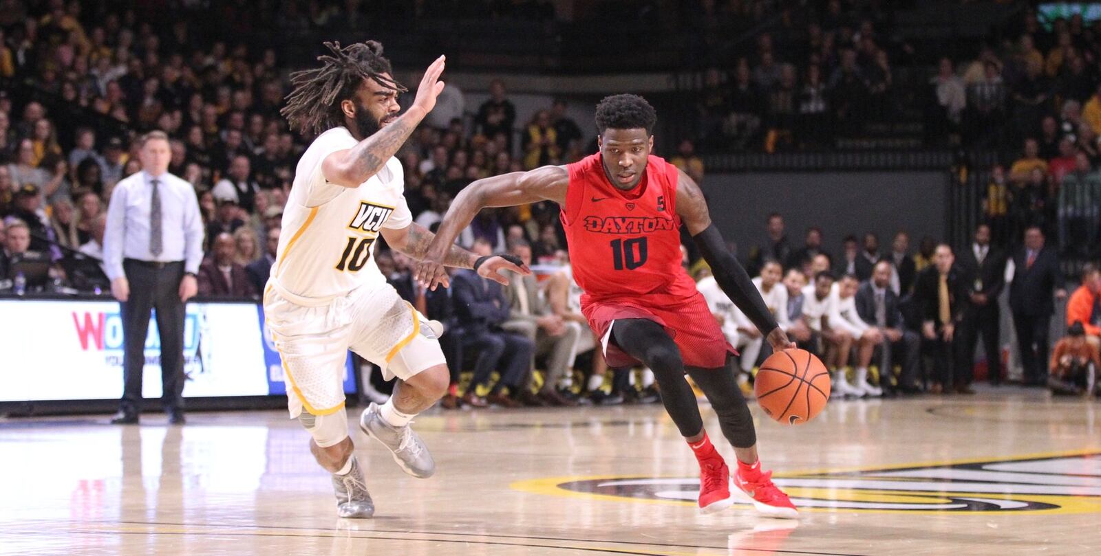 Dayton’s Jalen Crutcher dribbles against Virginia Commonwealth’s Jonathan Williams on Saturday, Feb. 10, 2018, at UD Arena. David Jablonski/Staff