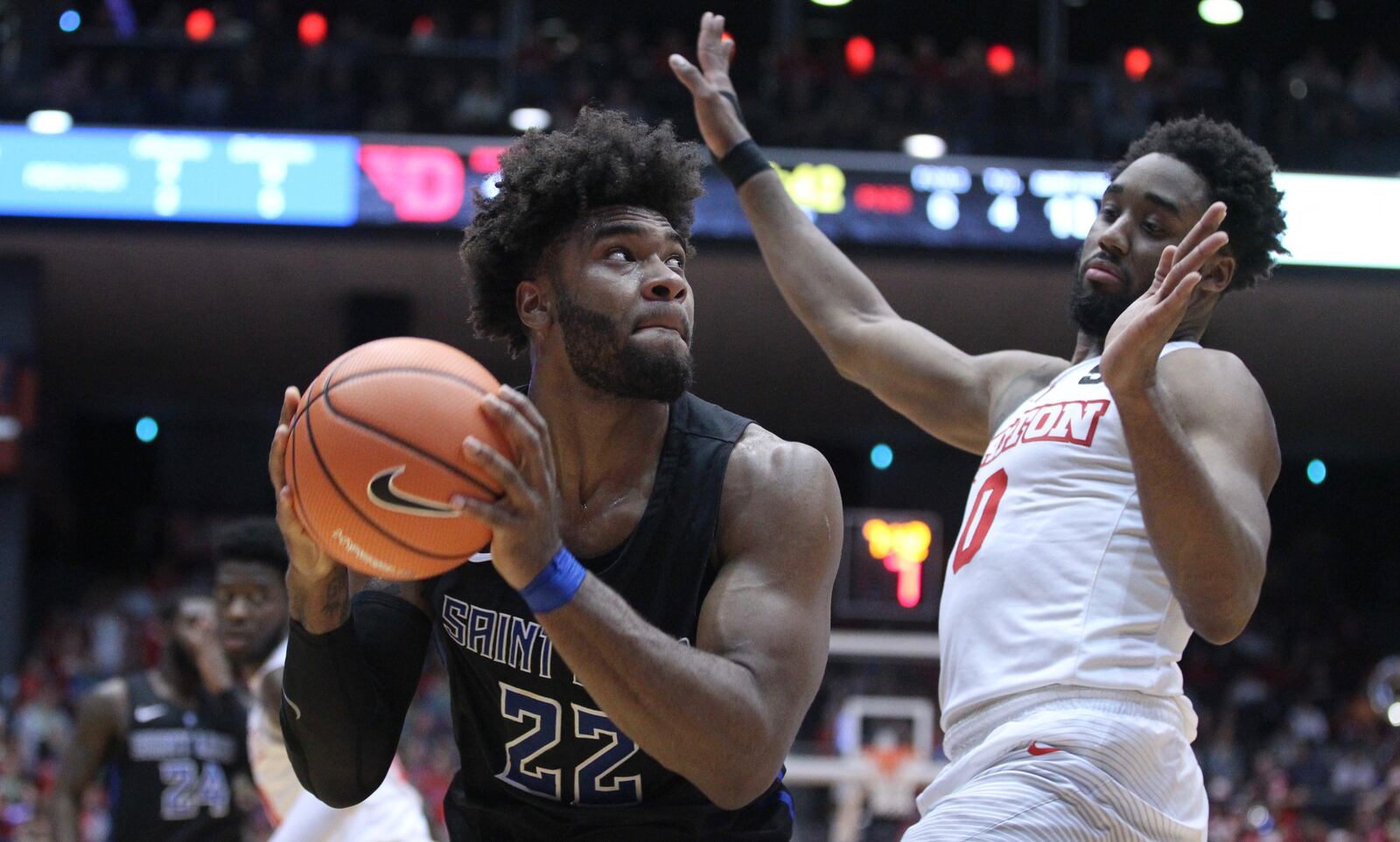 Hasahn French, of Saint Louis, looks for a shot against Dayton’s Josh Cunningham on Tuesday, Feb. 20, 2018, at UD Arena.