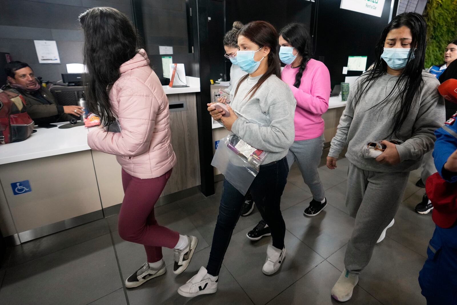 Colombian migrants deported from the United States arrive at El Dorado airport in Bogota, Colombia, Tuesday, Jan. 28, 2025. (AP Photo/Fernando Vergara)