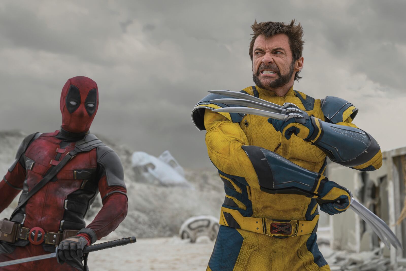 This image provided by The Walt Disney Studios shows the characters Deadpool, played by Ryan Reynolds, left, and Wolverine, played by Hugh Jackman, in a scene from the film "Deadpool & Wolverine," (The Walt Disney Studios via AP)