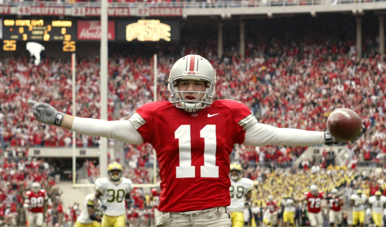 ** FILE ** Ohio State wide receiver Anthony Gonzalez celebrates his 68 yard touchdown reception from quarterback Troy Smith against Michigan at Ohio Stadium in Columbus, Ohio, in this Nov. 20, 2004 file photo. Top-ranked Ohio State takes on No. 2 Michigan on Saturday, Nov. 18, 2006 in Columbus. (AP Photo/Jay LaPrete)