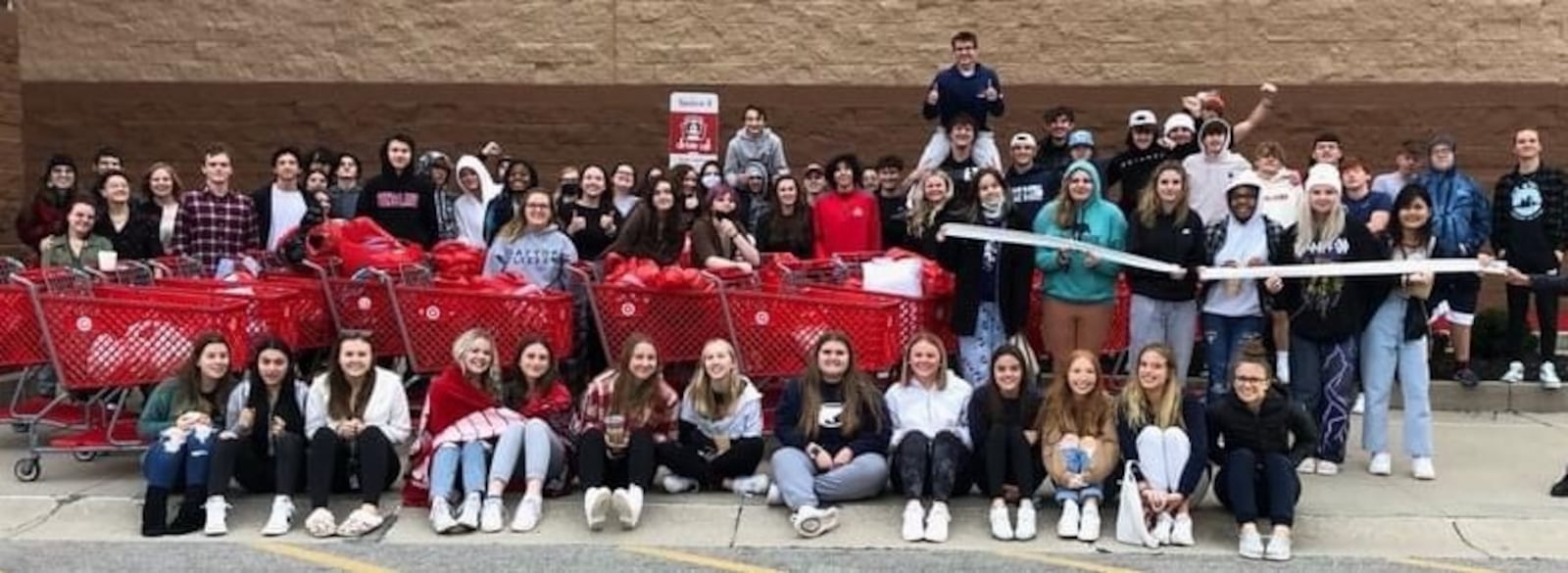 Dozens of Kettering Fairmont High School students went on a gift-buying spree after raising more than $6,000 for an adopt-a-family program. CONTRIBUTED