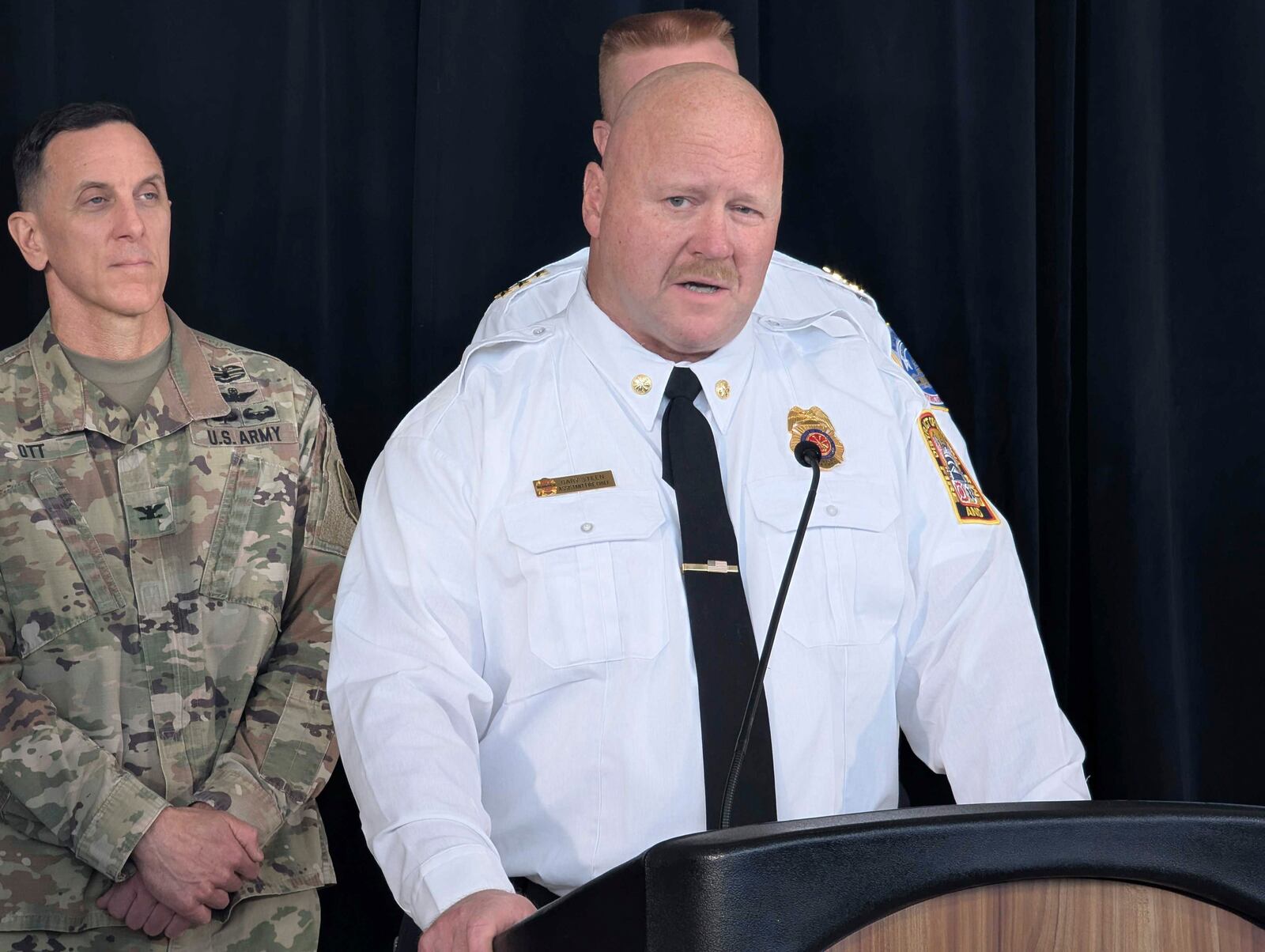 D.C. Fire and EMS Assistant Chief Gary Steen speaks during a news conference at Ronald Reagan Washington National Airport Monday, Feb. 3, 2025, in Arlington, Va. (AP Photo/Nathan Ellgren)