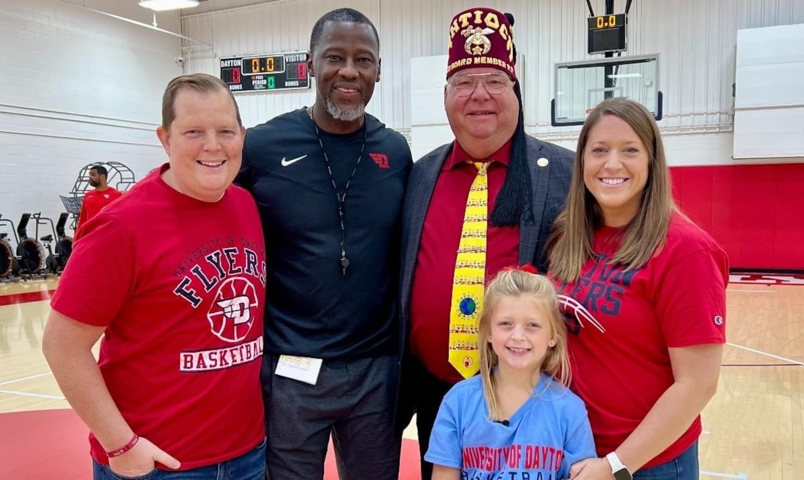 Six-year-old Parker Roche, a first grader at Anna Elementary School, flanked by her supporters (left to right) her dad Ryan Roche; UD coach Anthony Grant; John Bull, Vice Chairman of Shriners Children’s Ohio and a tireless fundraiser for children; mom Megan Roche. CONTRIBUTED