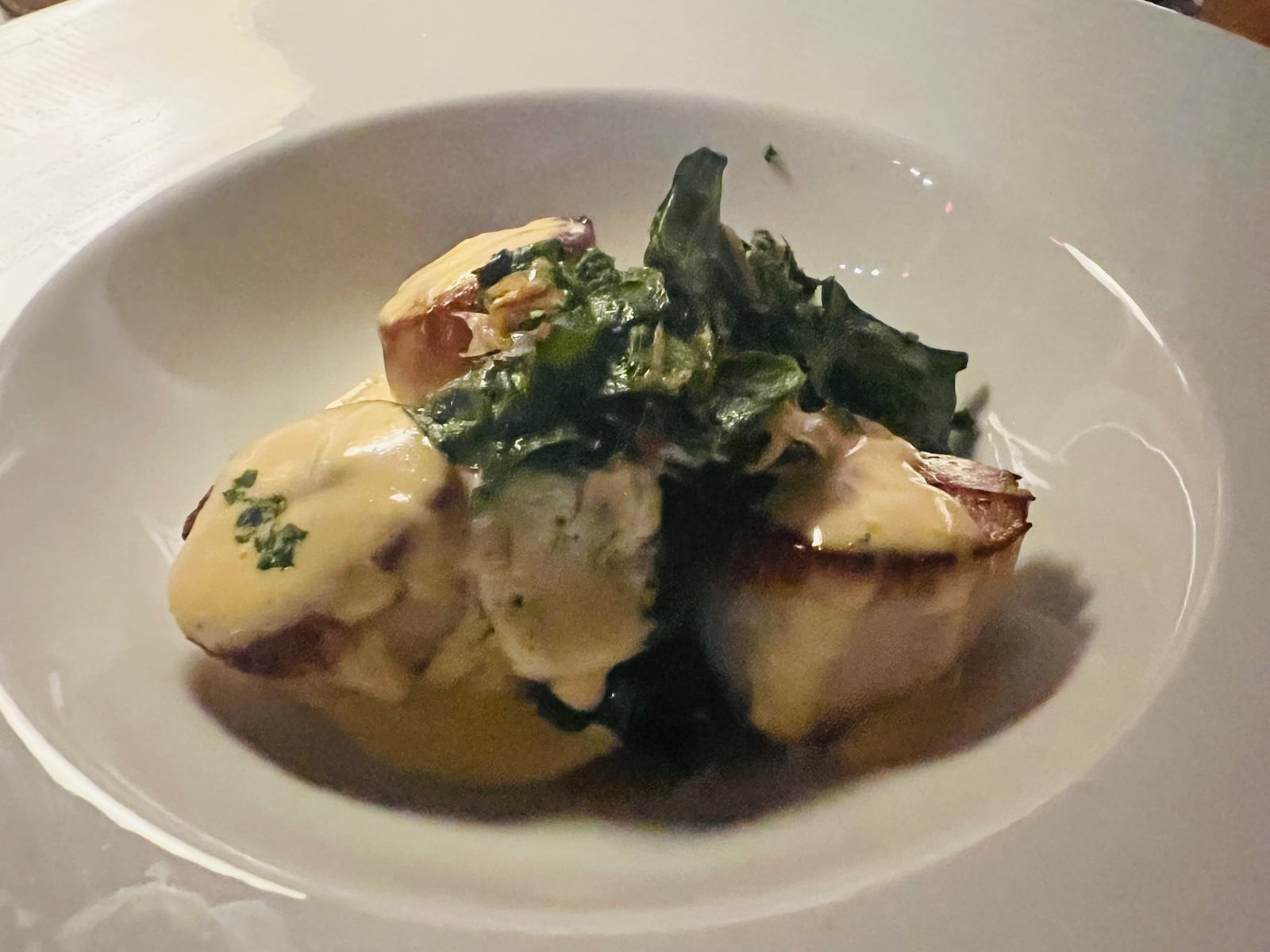 Table 33 opens for dinner: The star of the show and the entire meal was a fantastic seared scallop dish accompanied by a zesty blood orange Maltaise sauce served over a small bed of flavorful sautéed Swiss chard ($18). 
Photo by Alexis Larsen, Contributing Artist