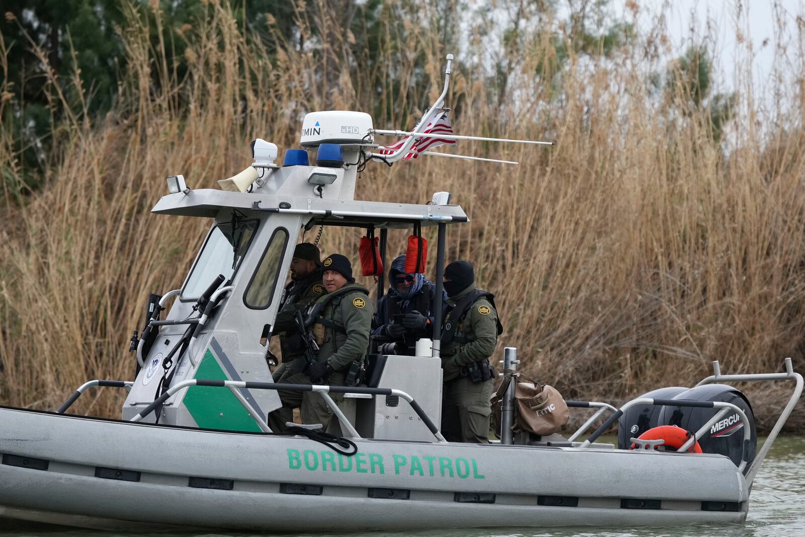 Border patrol agents patrol along the Rio Grande at the U.S.-Texas border, Thursday, Feb. 13, 2025, in McAllen, Texas. (AP Photo/Eric Gay)