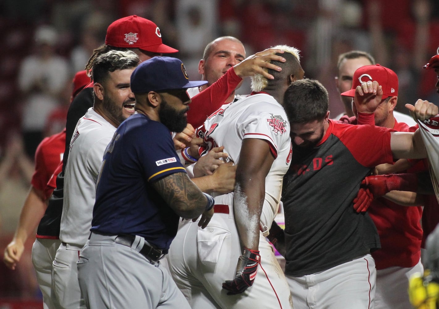 Photos: Reds beat Brewers on wild play in 11th