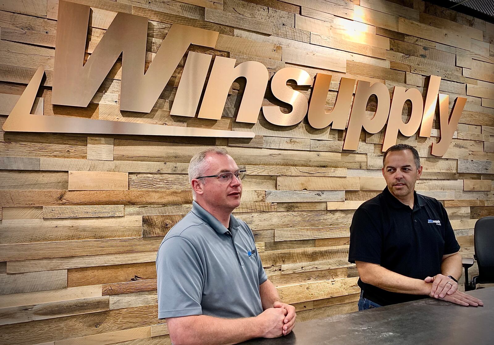 Bill Tolliver, Vice President Real Estate Service, left and Jeff Williams, President of Winsupply of Dayton, talk about the new Winsupply's Richard W. Schwartz Center for Innovation in Moraine. MARSHALL GORBY\STAFF