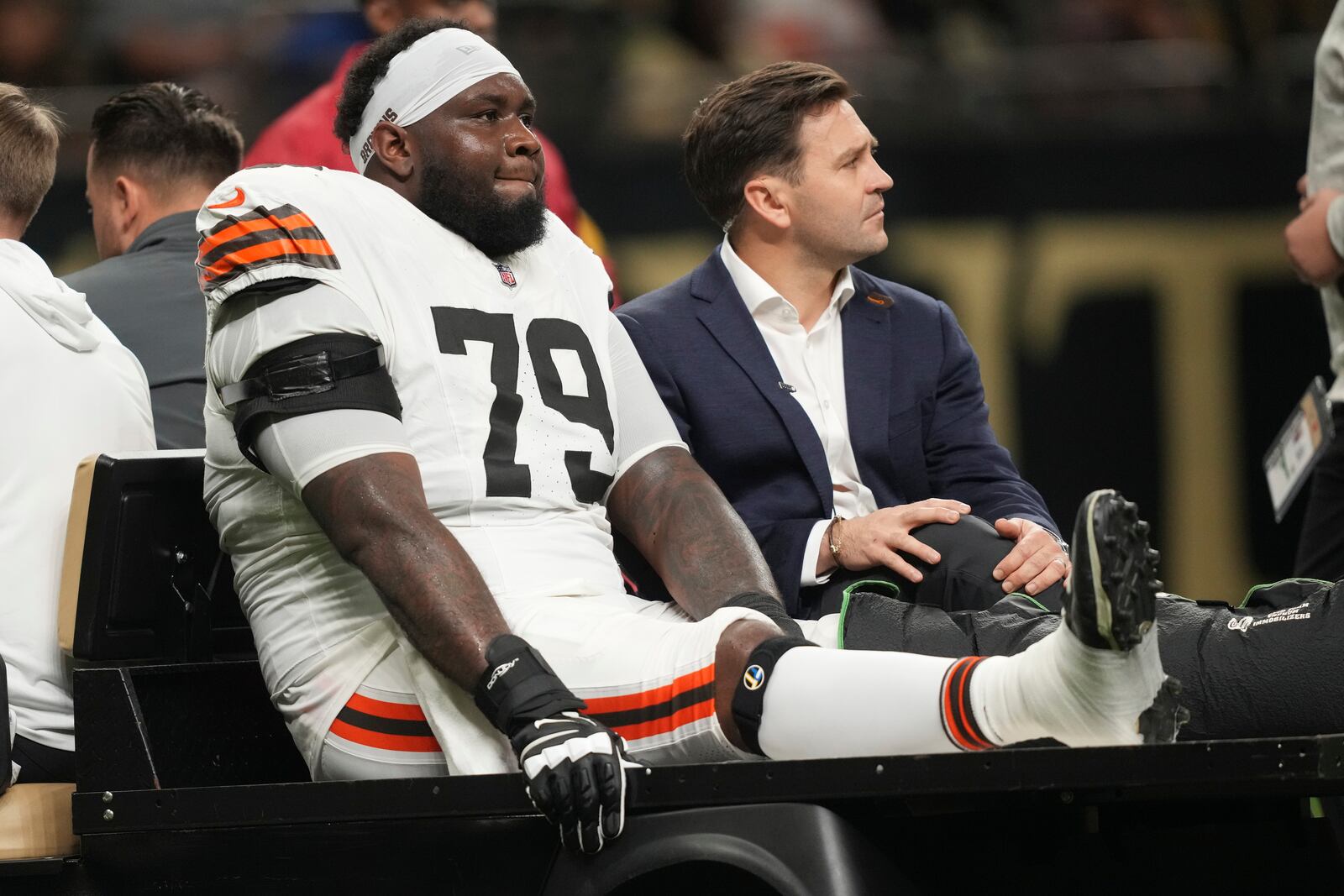 Cleveland Browns offensive tackle Dawand Jones (79) is carted off the field after an injury in the first half of an NFL football game against the New Orleans Saints in New Orleans, Sunday, Nov. 17, 2024. (AP Photo/Gerald Herbert)