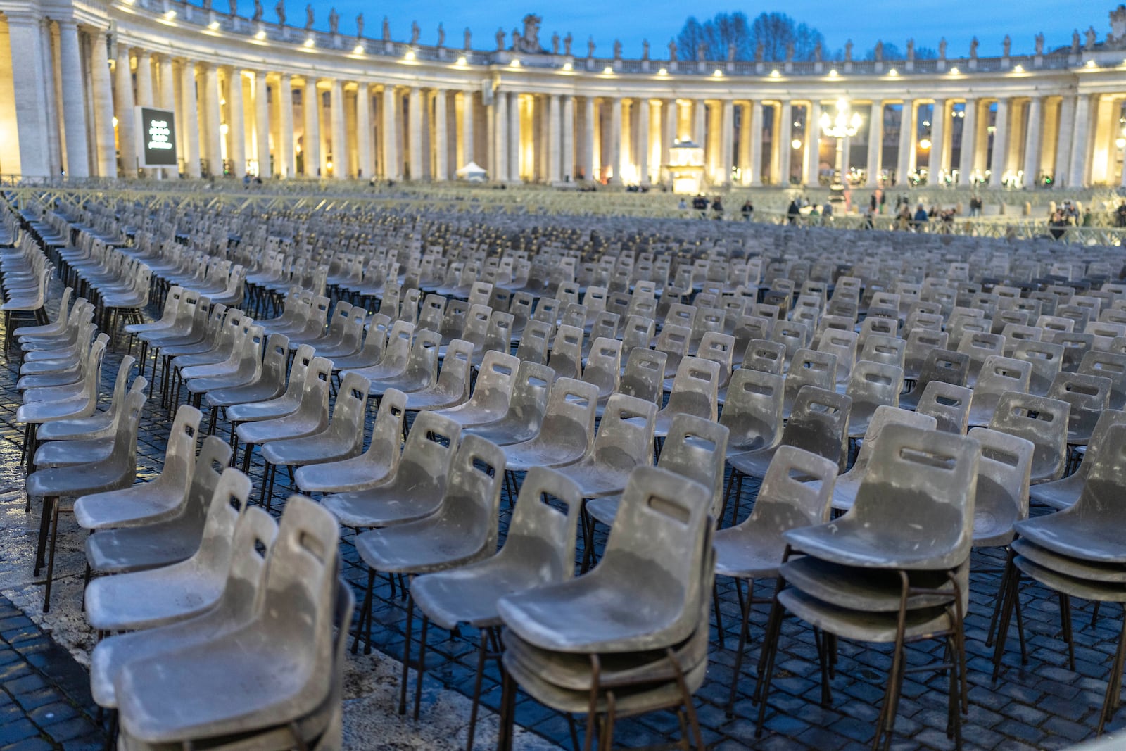 Chairs are prepared in St. Peter's Square at The Vatican, Monday, Feb. 24, 2025, ahead of a rosary vigil prayer for the health of Pope Francis who is in critical conditions at the Agostino Gemelli Polyclinic in Rome. (AP Photo/Mosa'ab Elshamy)