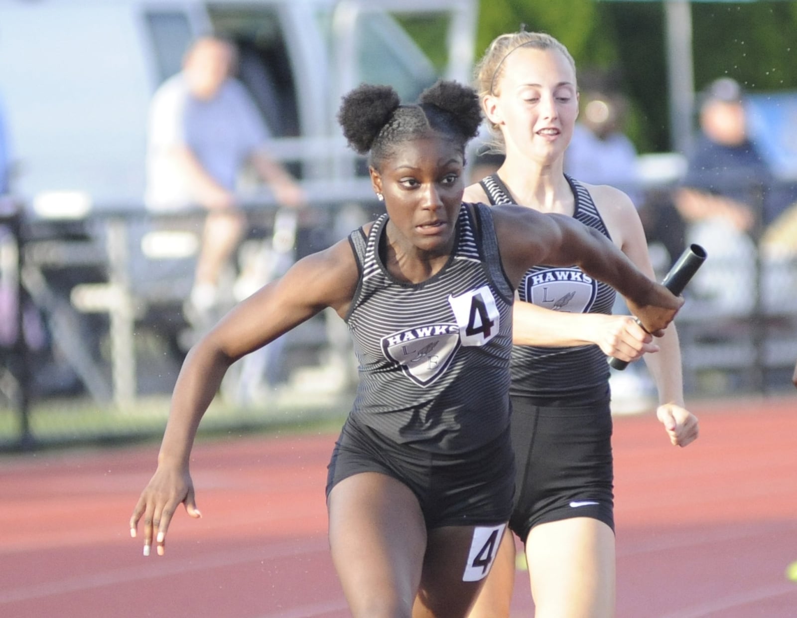 Lakota East’s Serena Clark (front) takes a handoff in the 4x100 relay during the D-I state track and field meet at OSU’s Jesse Owens Memorial Stadium in Columbus on Friday, June 1, 2018. MARC PENDLETON / STAFF