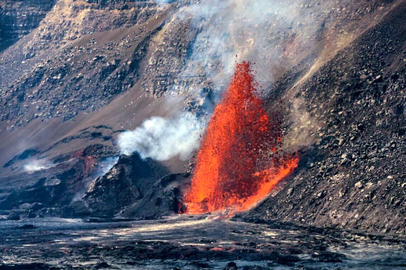 In this photo provided by Janice Wei, lava fountains from an eruption of Kilauea volcano on Wednesday, Jan., 15, 2025, in Hawaii. (Janice Wei/NPS via AP)