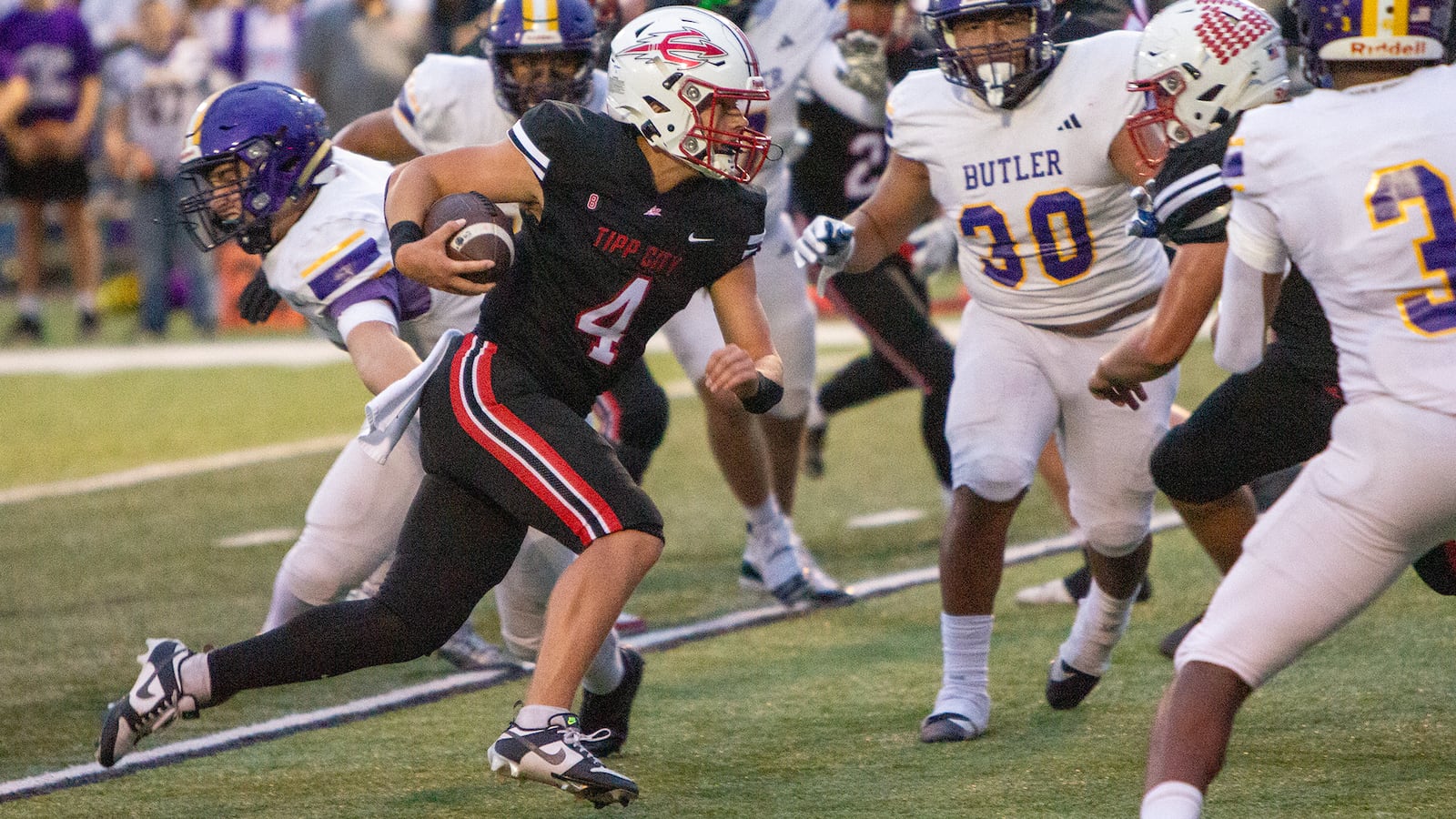 Tippecanoe quarterback runs for yardage against Vandalia Butler earlier this season. Jeff Gilbert/CONTRIBUTED