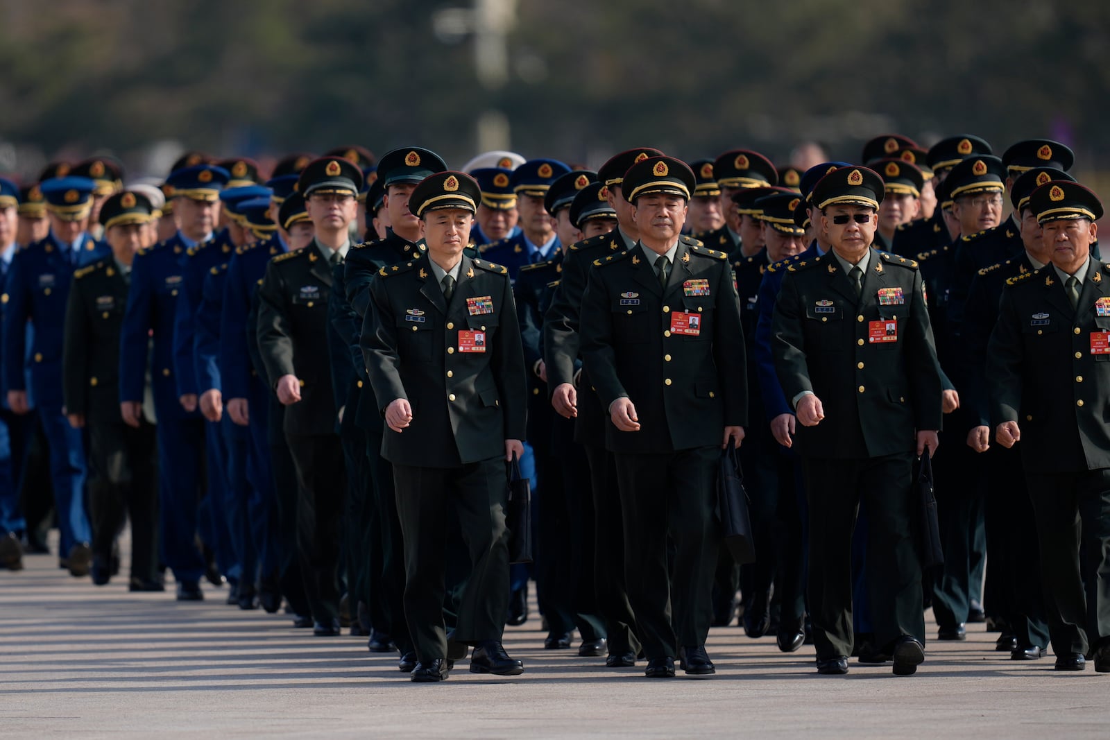 Chinese military delegates attend a pre-session on the eve of the opening of the National People's Congress at the Great Hall of the People in Beijing, Tuesday, March 4, 2025. (AP Photo/Ng Han Guan)