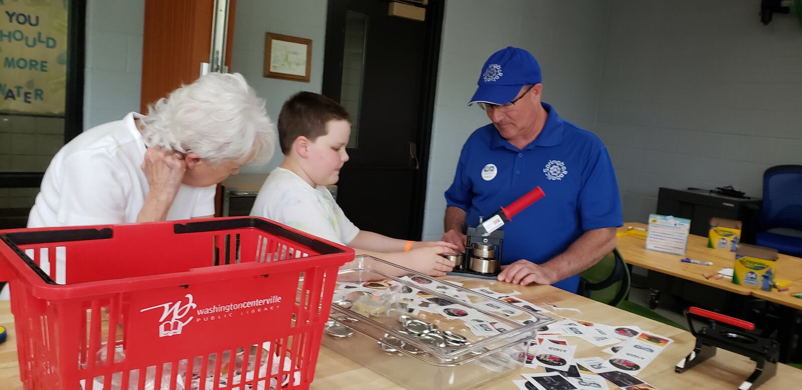 Patrons learn how to make buttons at the new Creativity Commons inside Washington Township RecPlex, Thursday, June 16, 2022. The initiative is powered by Washington Twp.-Centerville Public Library and takes place in 800 square feet of leased space within the RecPlex. CONTRIBUTED