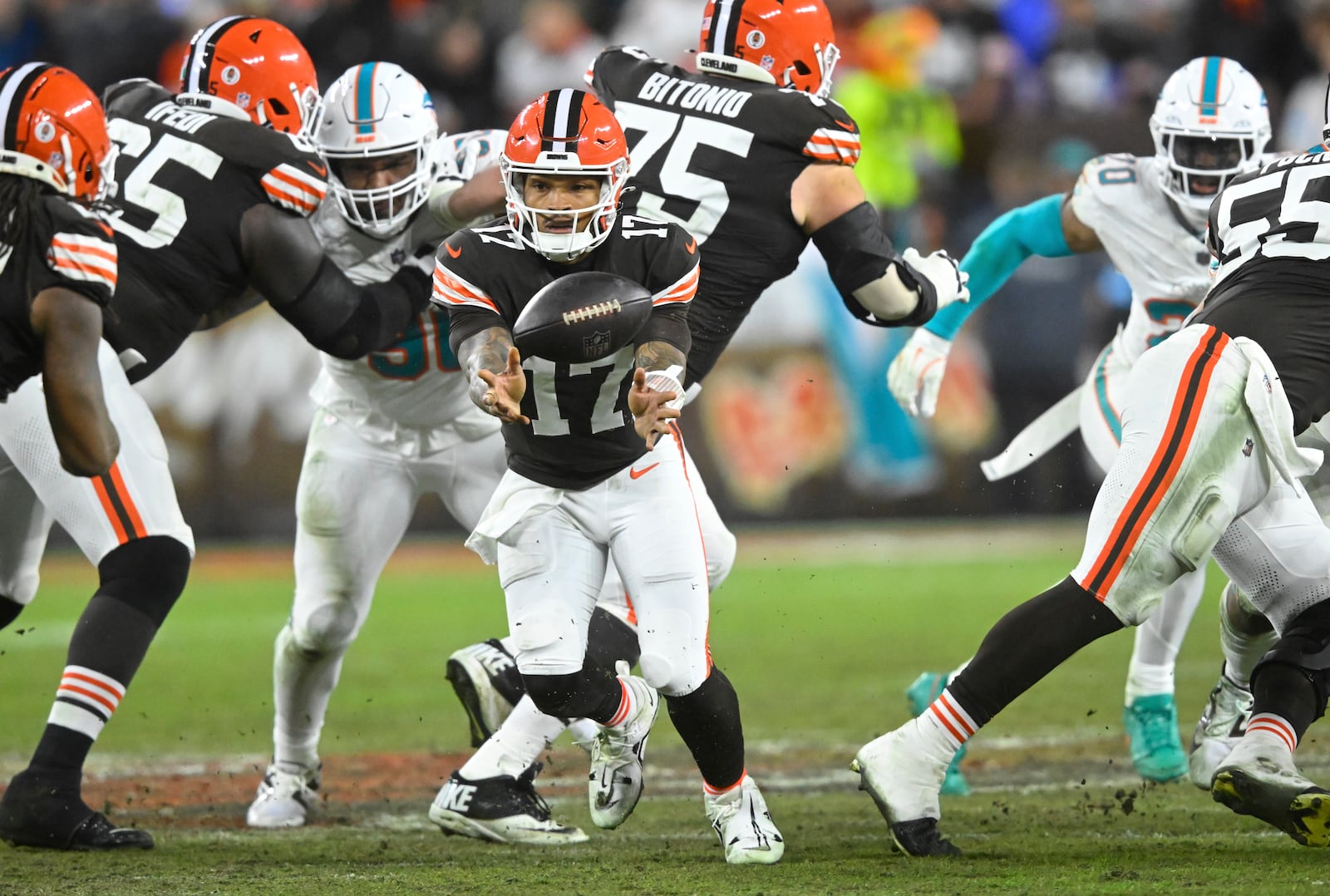 Cleveland Browns quarterback Dorian Thompson-Robinson (17) pitches the ball during the second half of an NFL football game against the Miami Dolphins Sunday, Dec. 29, 2024, in Cleveland. (AP Photo/David Richard)