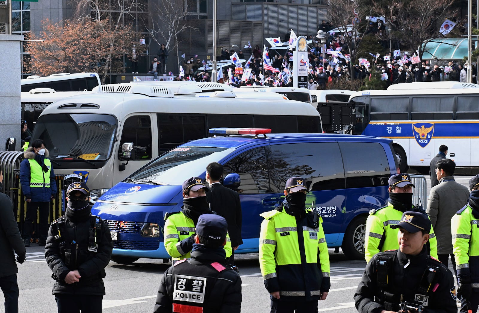 A vehicle carrying impeached South Korean President Yoon Suk Yeol arrives at the Seoul Western District Court in Seoul, South Korea, Saturday, Jan. 18, 2025. (Kim Min-Hee/Pool Photo via AP)