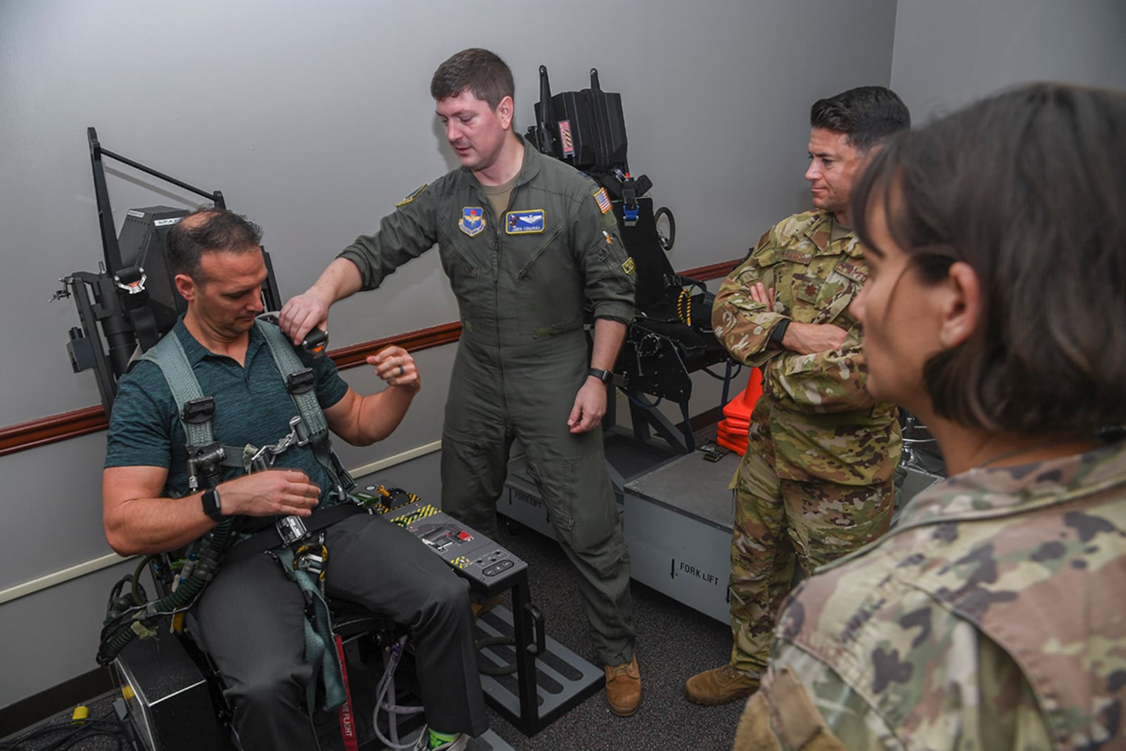 Dr. John Gassaway receives instruction on how to secure himself and egress from an ejection seat in preparation for an orientation flight at Columbus Air Force Base, Miss., on April 13. One of the many aspects of Air Force Aviation Psychology is focused on resiliency and readiness of its aircrews’ daily activities by addressing the human factors involved in safe and effective performance. U.S. AIR FORCE PHOTO/KEITH WRIGHT