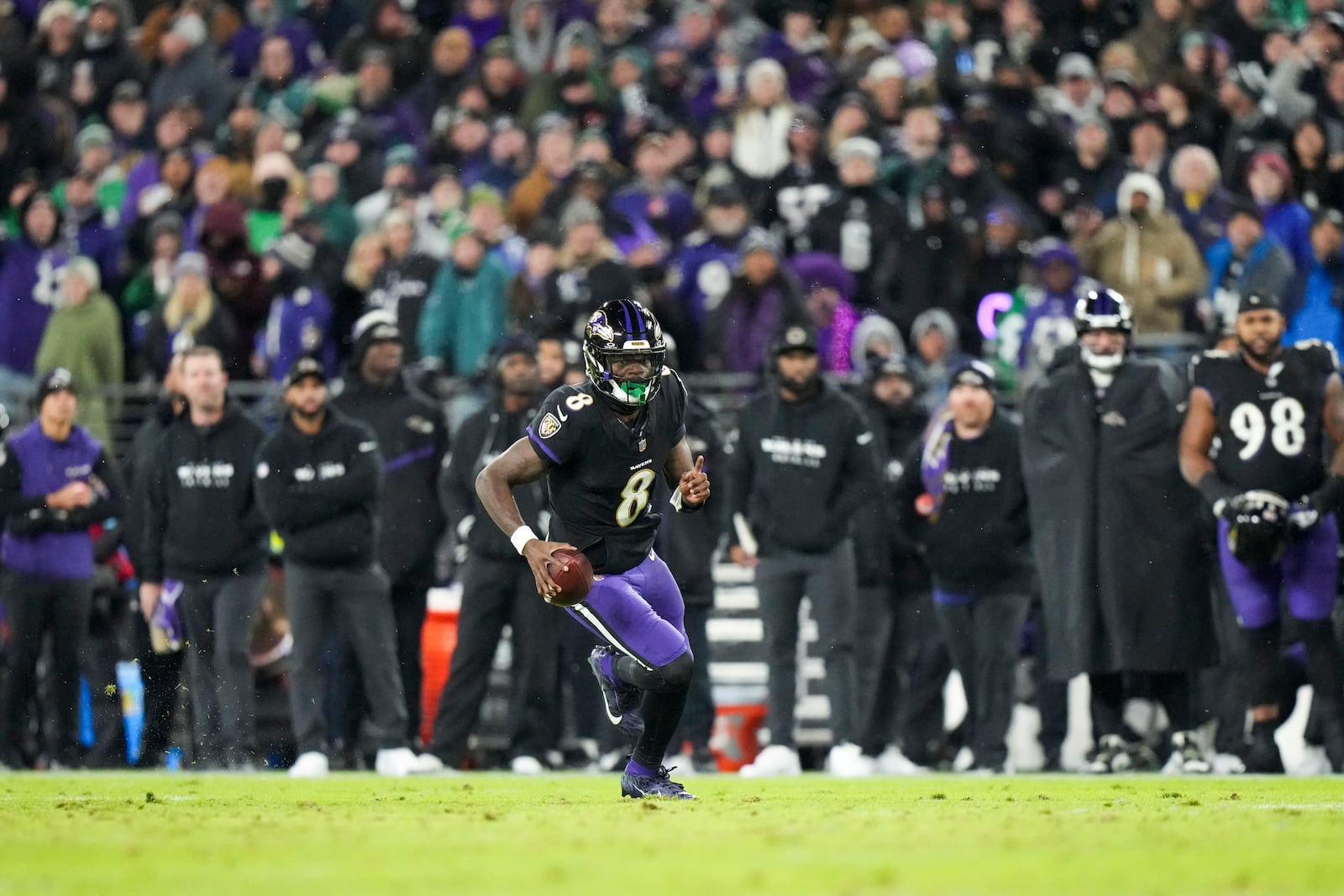 Baltimore Ravens quarterback Lamar Jackson runs with the ball against the Philadelphia Eagles during the first half of an NFL football game, Sunday, Dec. 1, 2024, in Baltimore. (AP Photo/Stephanie Scarbrough)