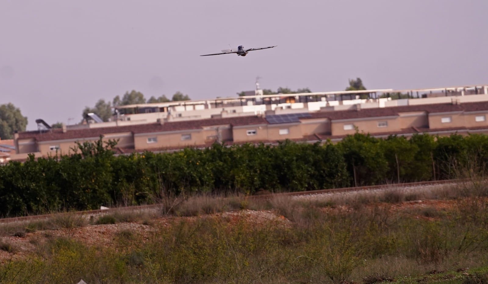 A drone operated by the Spanish Parachute Squadron (EZAPAC) flies over the area in the search for bodies after floods in Barranco del Poyo on the outskirts of Valencia, Spain, Tuesday, Nov. 5, 2024. (AP Photo/Alberto Saiz)