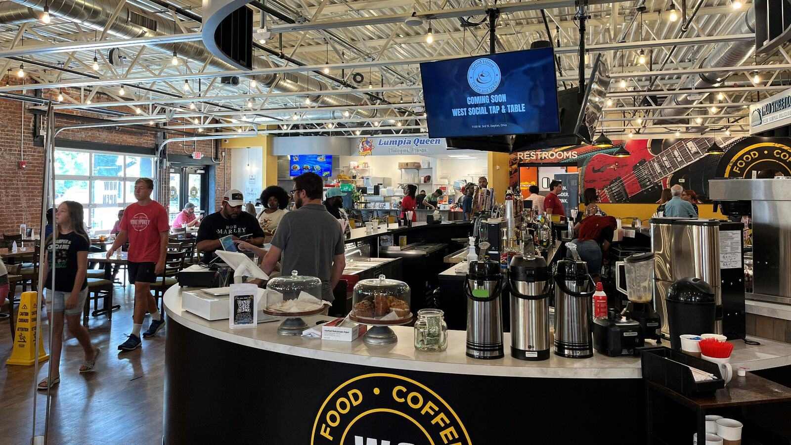 West Social Tap & Table food hall in the Wright Dunbar business district opened in July and will host a block party on Aug. 23 to celebrate. CORNELIUS FROLIK / STAFF