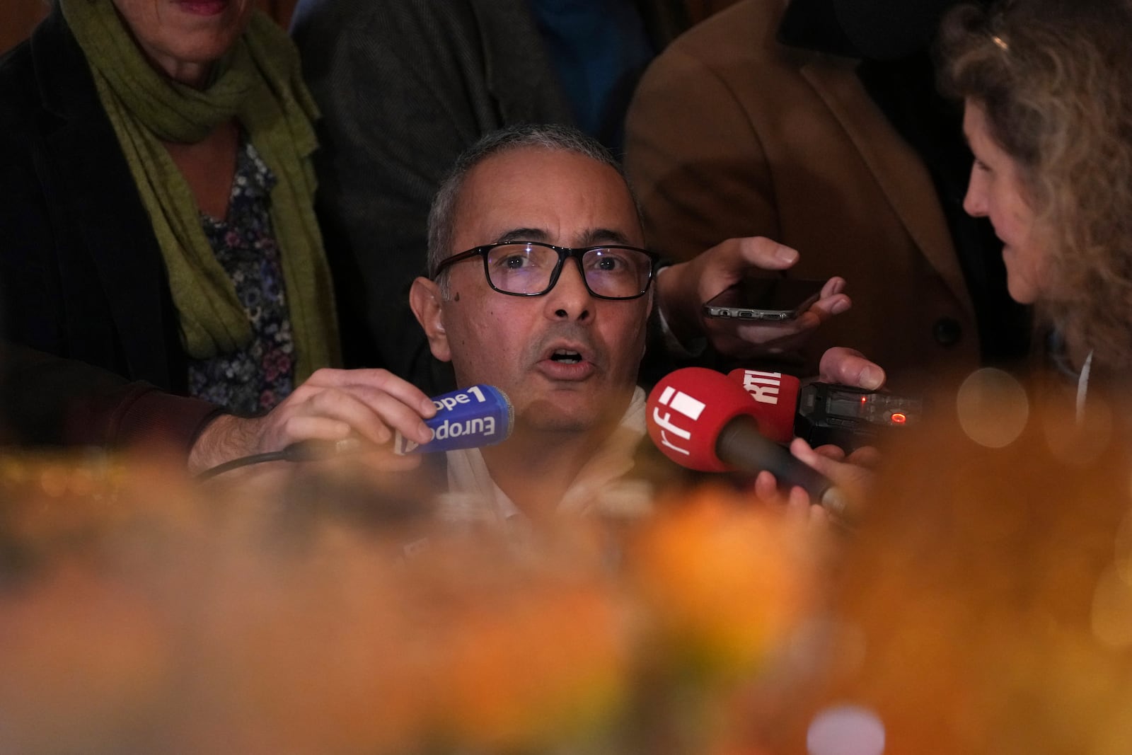 Algerian-French novelist Kamel Daoud answers reporters after being awarded with the Goncourt prize for his book Houris, France's most prestigious literary prize, Monday, Nov. 4, 2024 in Paris. (AP Photo/Aurelien Morissard)