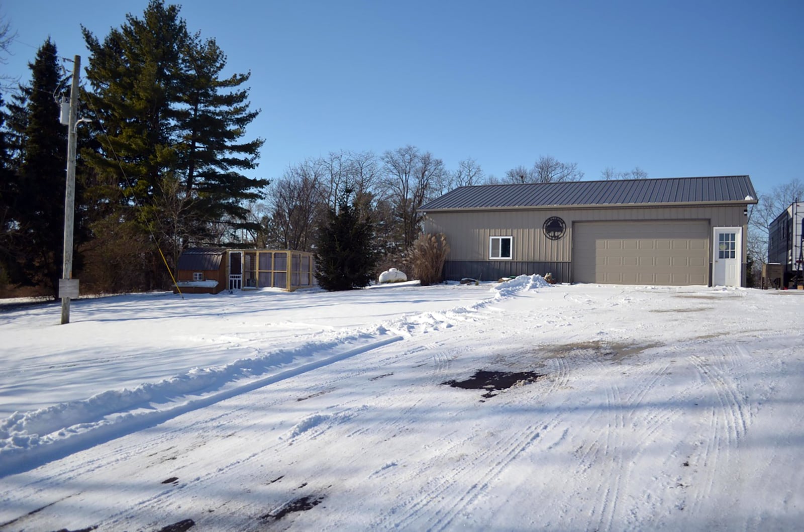 The pole barn and newly renovated chicken coop both have electricity and water.