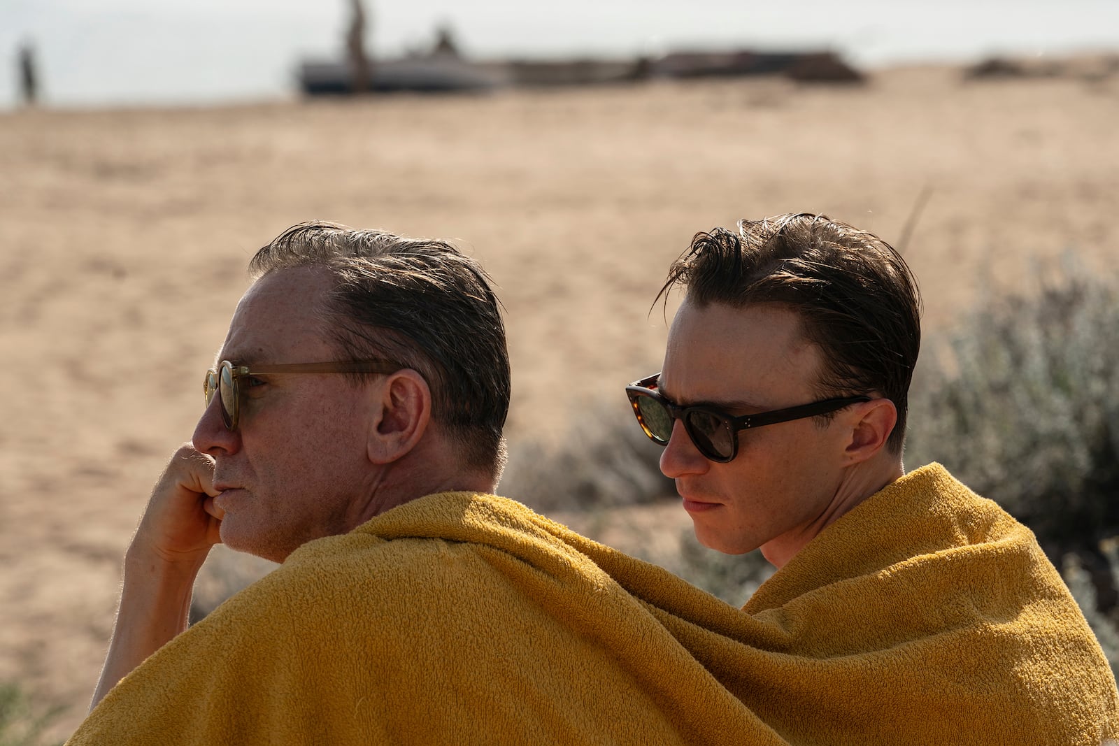 This image released by A24 shows Daniel Craig, left, and Drew Starkey in a scene from "Queer." (Yannis Drakoulidis/A24 via AP)