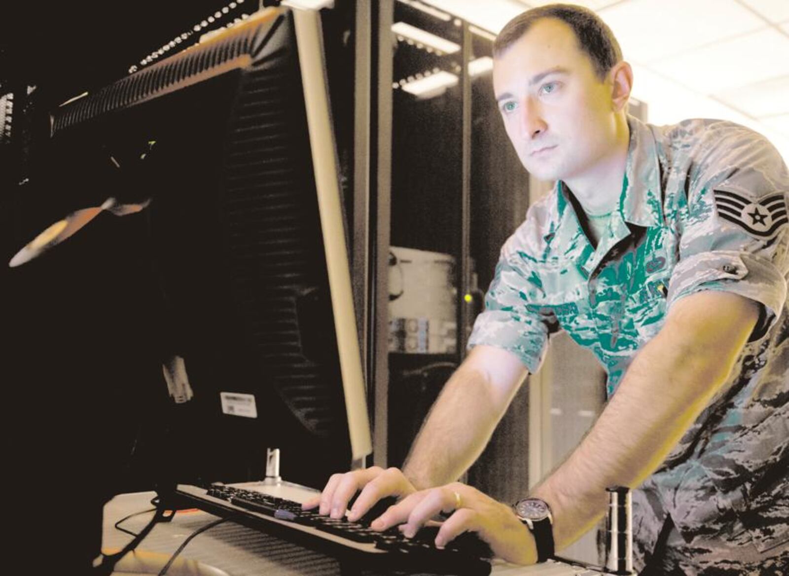 Staff Sgt. Kacper Sovinski, Geospatial Intelligence Analysis Squadron research and development project manager, upgrades data drives for the airborne sensor servers July 17 at the National Air and Space Intelligence Center, Wright-Patterson Air Force Base. Sovinski was recently named one of the 12 Outstanding Airmen of the Year by the Air Force. (U.S. Air Force photo/Senior Airman Jonathan Stefanko)