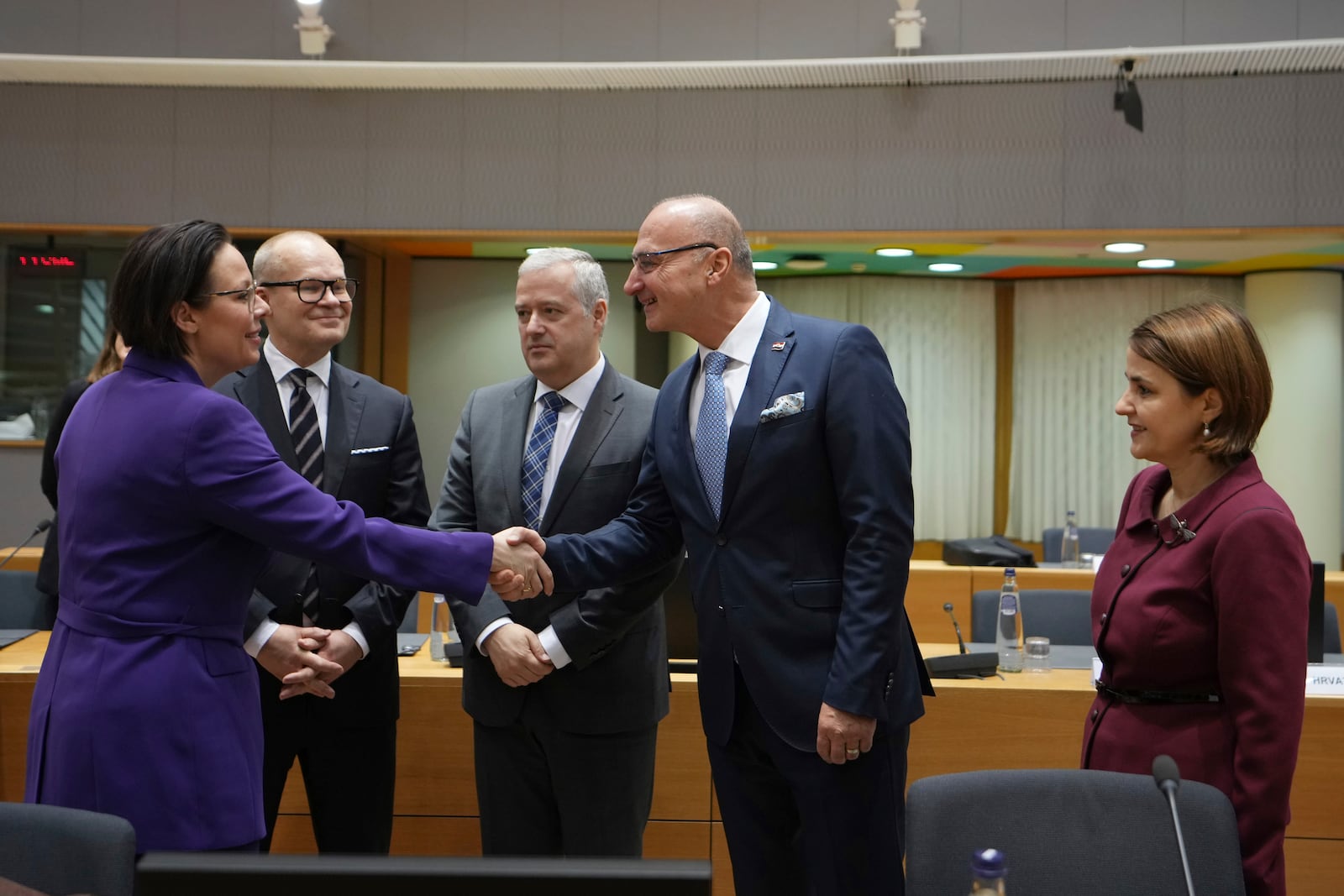 Sweden's Foreign Minister Maria Malmer Stenergard, left, shakes hands with Croatia's Foreign Minister Gordan Grlic Radman, second right, during a meeting of EU foreign ministers at the European Council building in Brussels, Monday, Dec 16, 2024. (AP Photo/Virginia Mayo)