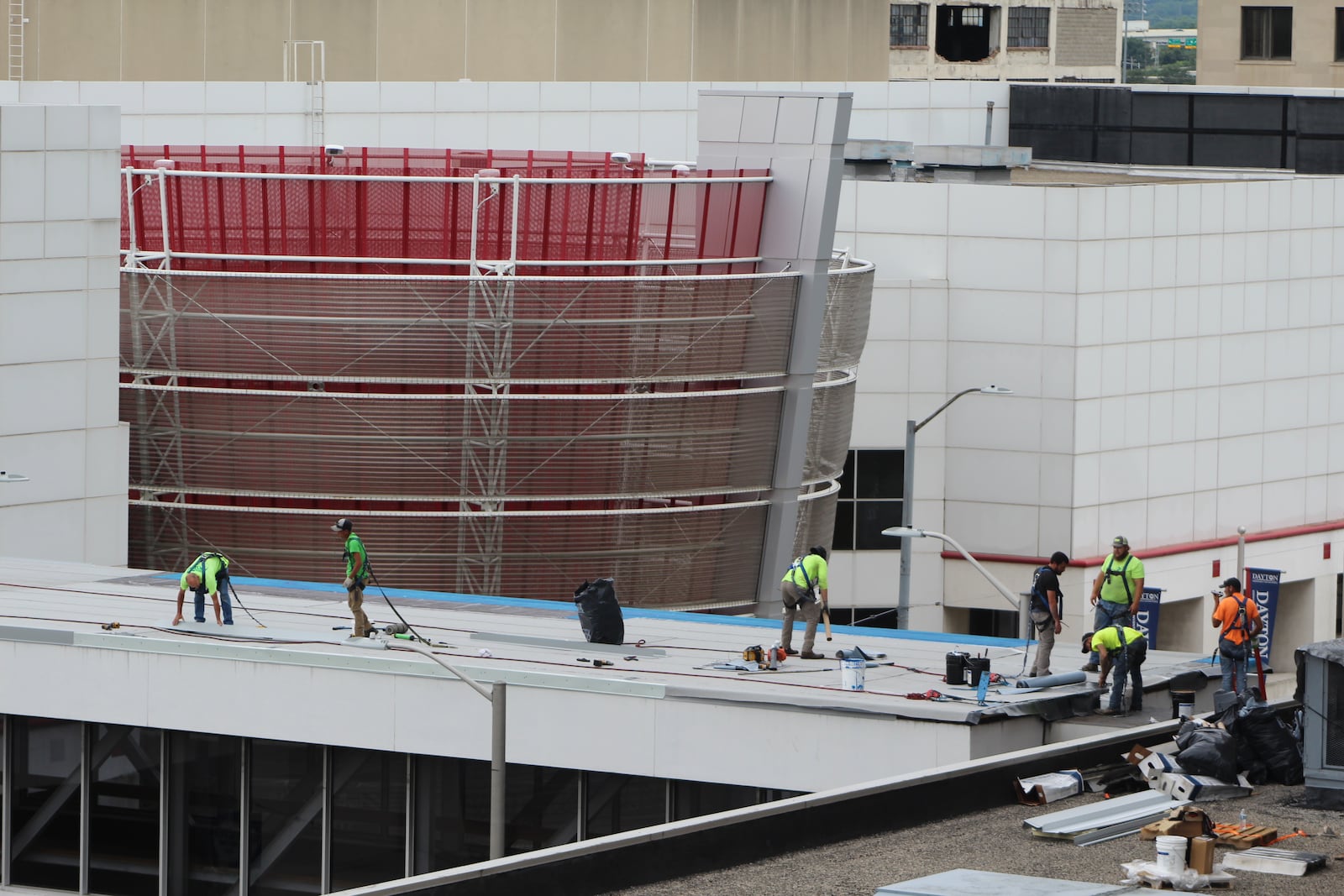 Crews work on the skywalk leading from the Dayton Convention Center to the hotel across the street and the parking garage. CORNELIUS FROLIK / STAFF