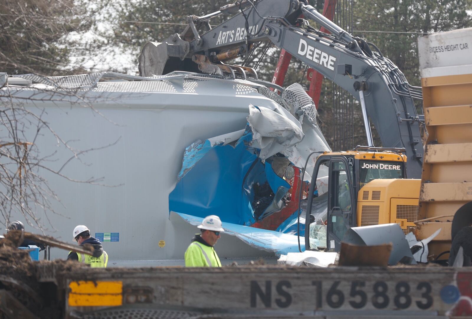 Heavy machinery is expected to remain in the area of State Route 41 near the Clark County Fairgrounds as cleanup of Saturday's train derailment continued Monday, March 6, 2023. BILL LACKEY/STAFF